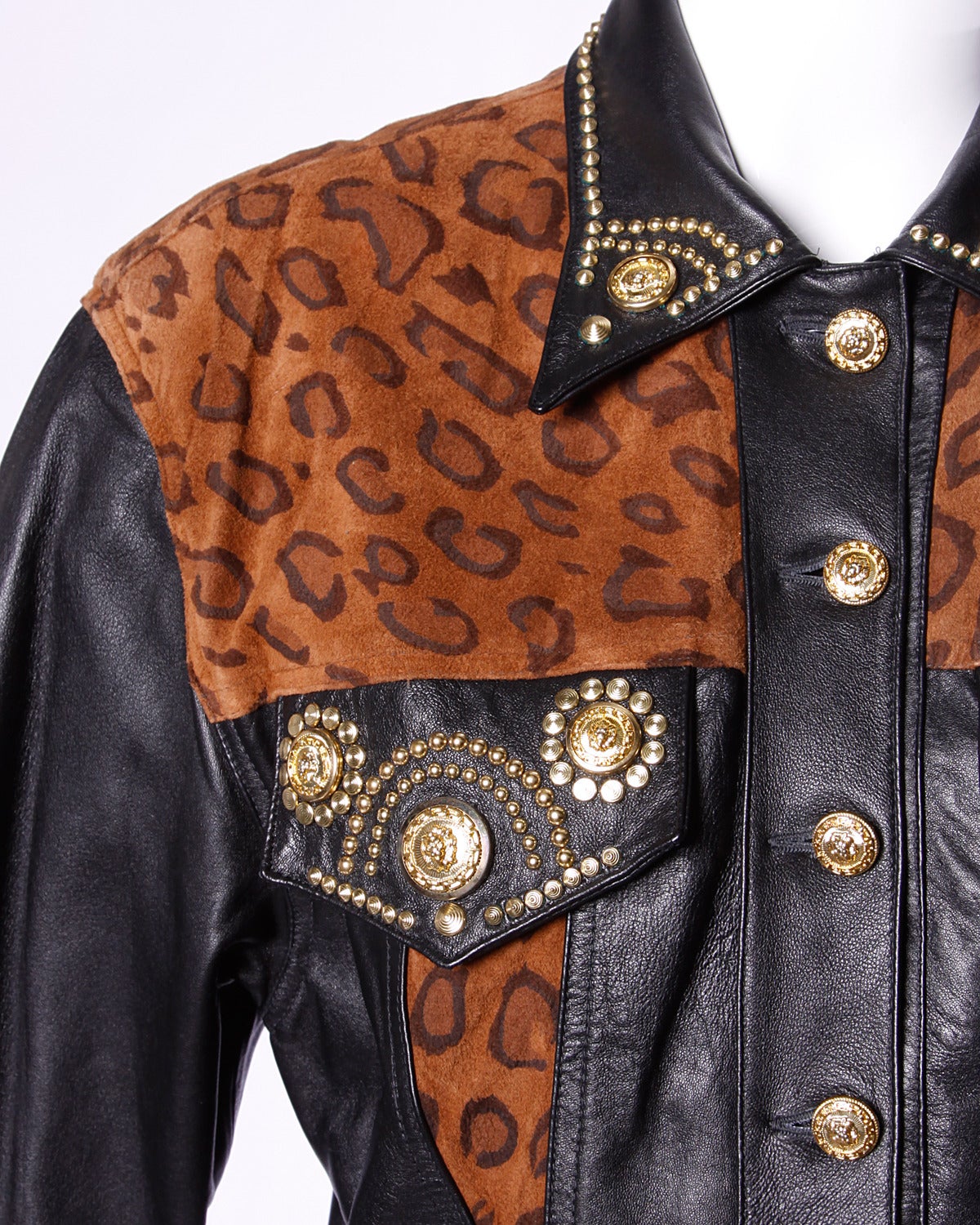 Versace-inspired buttery soft leather jacket with brown leopard print detailing, gold studding and lion's head buttons. By Lillie Rubin.

Details:

Fully Lined
Shoulder Pads Are Sewn Into Lining
Estimated Size: Small-Medium
Color: Brown/