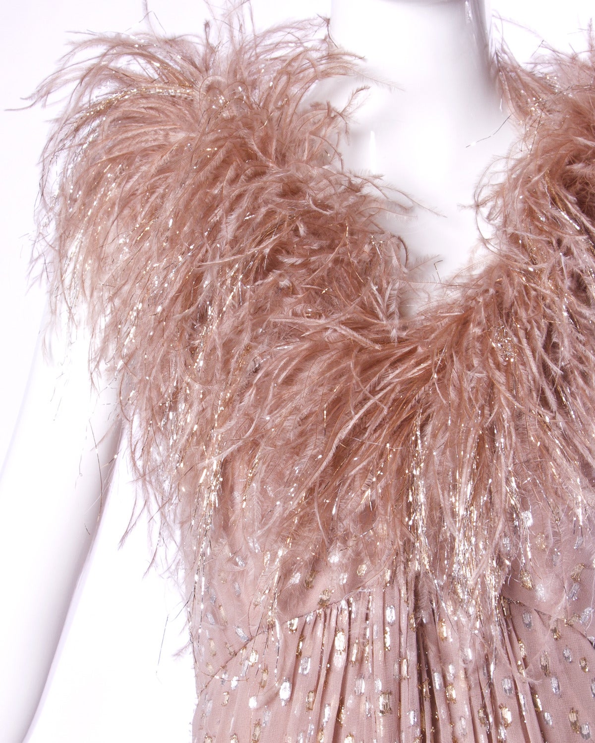 Reduced from $595. Vintage Victor Costa maxi dress in metallic-flecked nude chiffon with a matching feather neckline in the same colors. 

Details:

Fully Lined
Back Zip and Hook Closure
Estimated Size: M-L
Color: Taupe/ Gold/ Silver
Label: