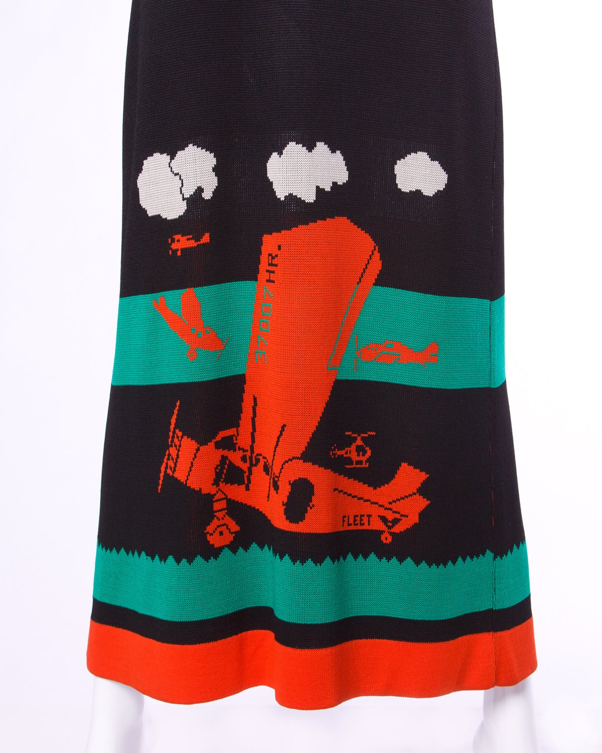 Iconic Giorgio Sant'Angelo knit maxi dress with a colorful airplane design. A collector's piece!

Details:

Unlined
No Closure/ Fabric Contains Stretch
Marked Size: Not Marked
Estimated Size: Small
Color: Orange Red/ Black/ Green/