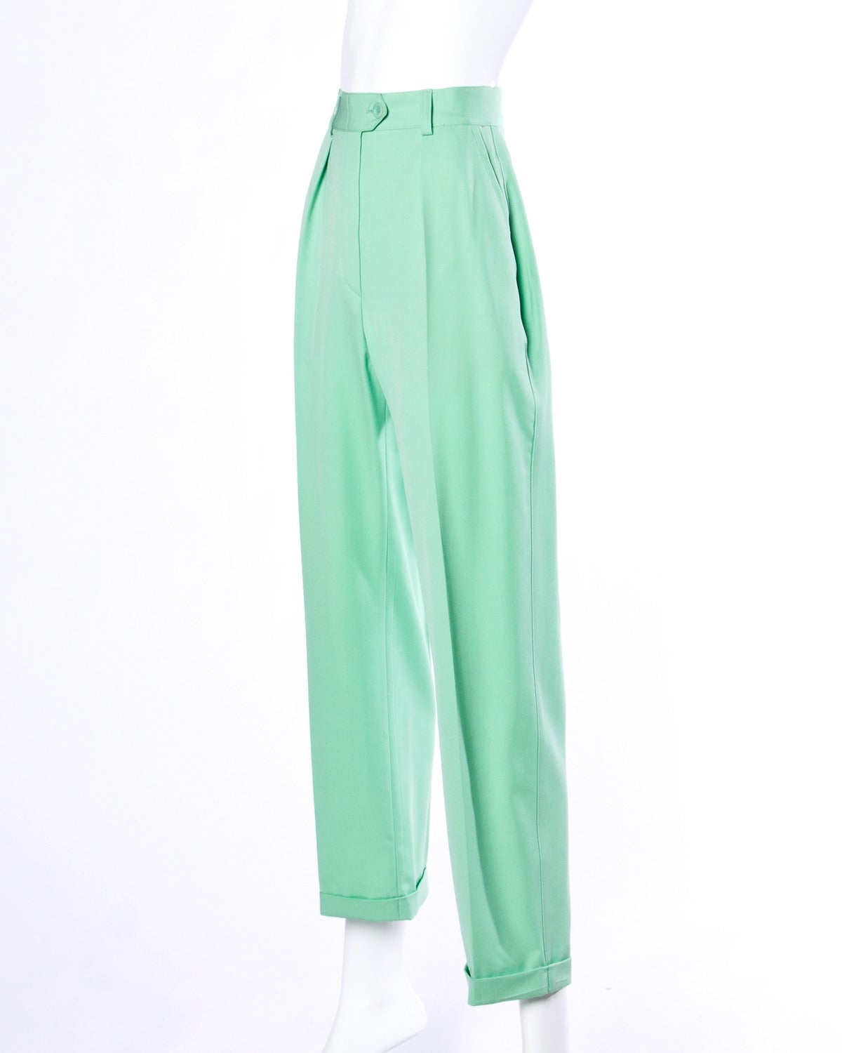 Tailored high waisted wool trousers in mint green by Escada.

Details:

Unlined
Side Pockets
Front Zip and Button Closure
Marked Size: 34
Estimated Size: XS
Color: Mint Green
Fabric: Wool
Label: Escada

Measurements:

Waist: