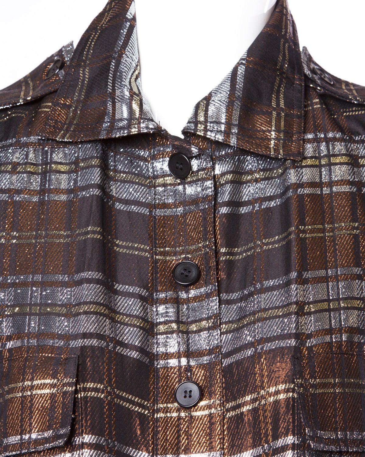 Fantastic vintage metallic plaid shirt dress by Jean Louis Scherrer for the famous Beverly Hills Boutique Giorgio. Long sleeves and front button closure.

Details:

Fully Lined in Silk
Metallic Plaid
Shoulder Pads are Sewn Into the