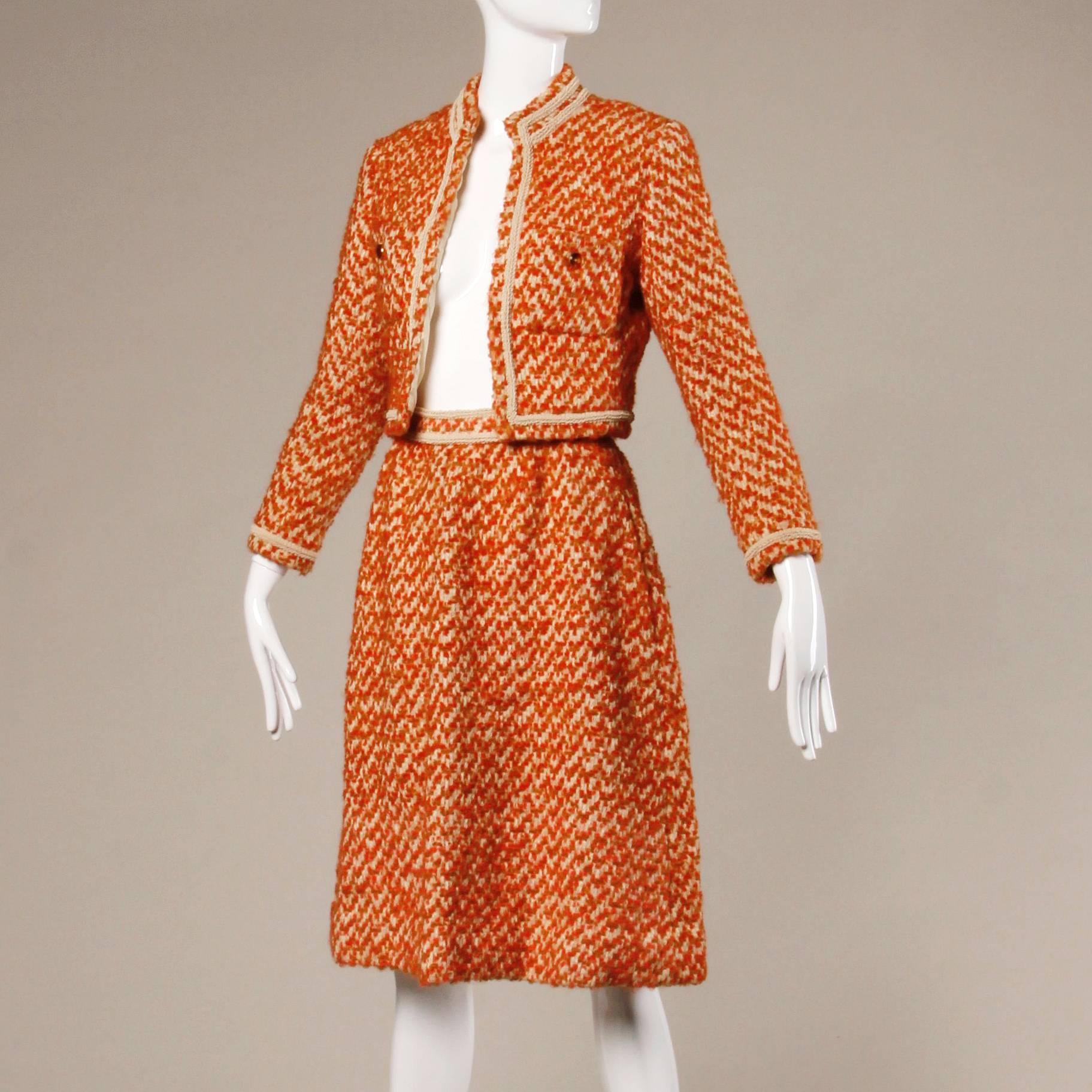 Stunning vintage couture jacket and skirt suit by Nina Ricci from the 1960s. Colorful boucle wool with creamy silk lining- every stitch sewn by hand! Gorgeous condition and tailoring.

Details:

Fully Lined in Silk
Front Pockets On Jacket/ Side
