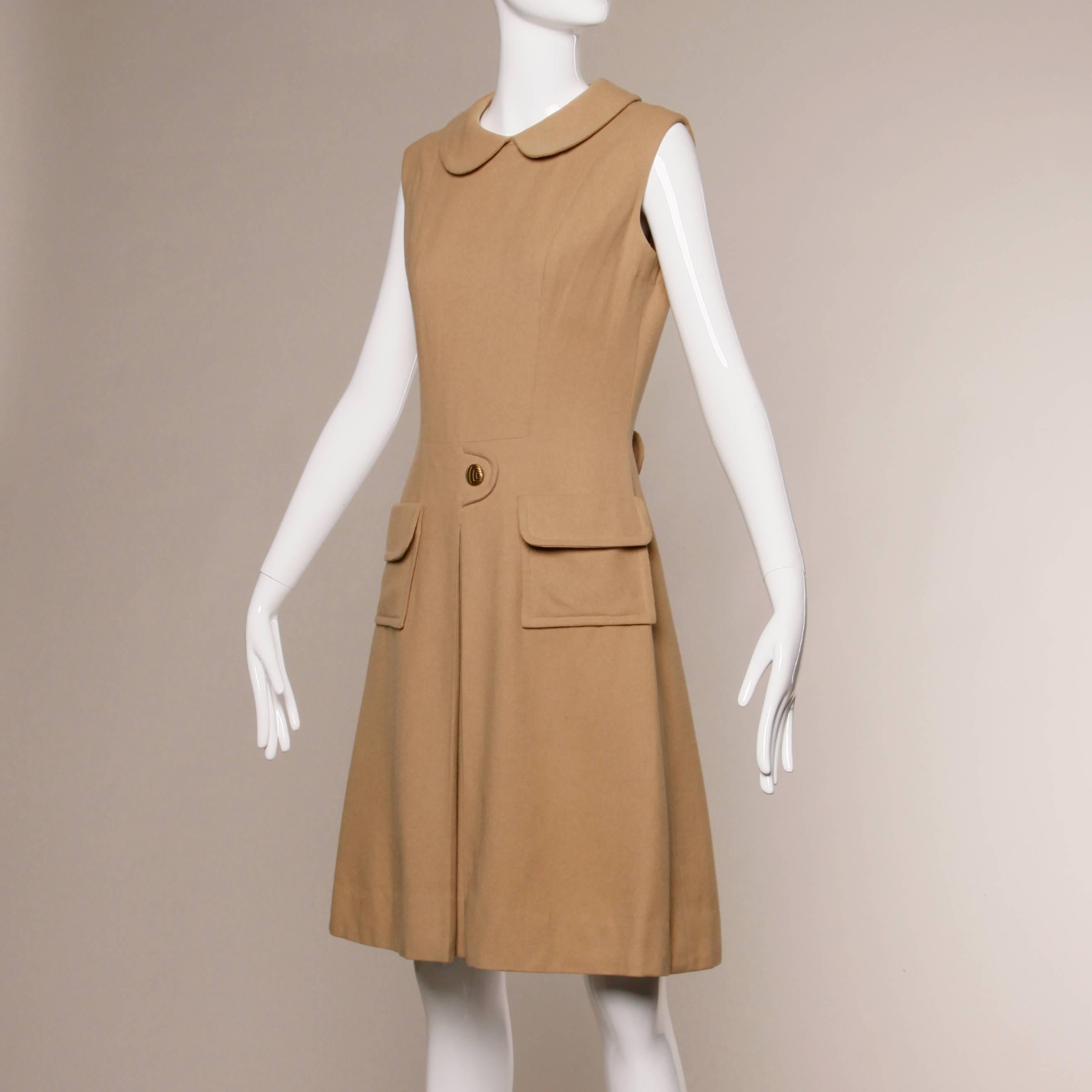 Darling vintage 1960s mod dress with a Peter Pan collar and front kick pleat. Tailored by Sloat & Co New York. Rear zip and hook closure. Front pockets. Unlined. Bust 36