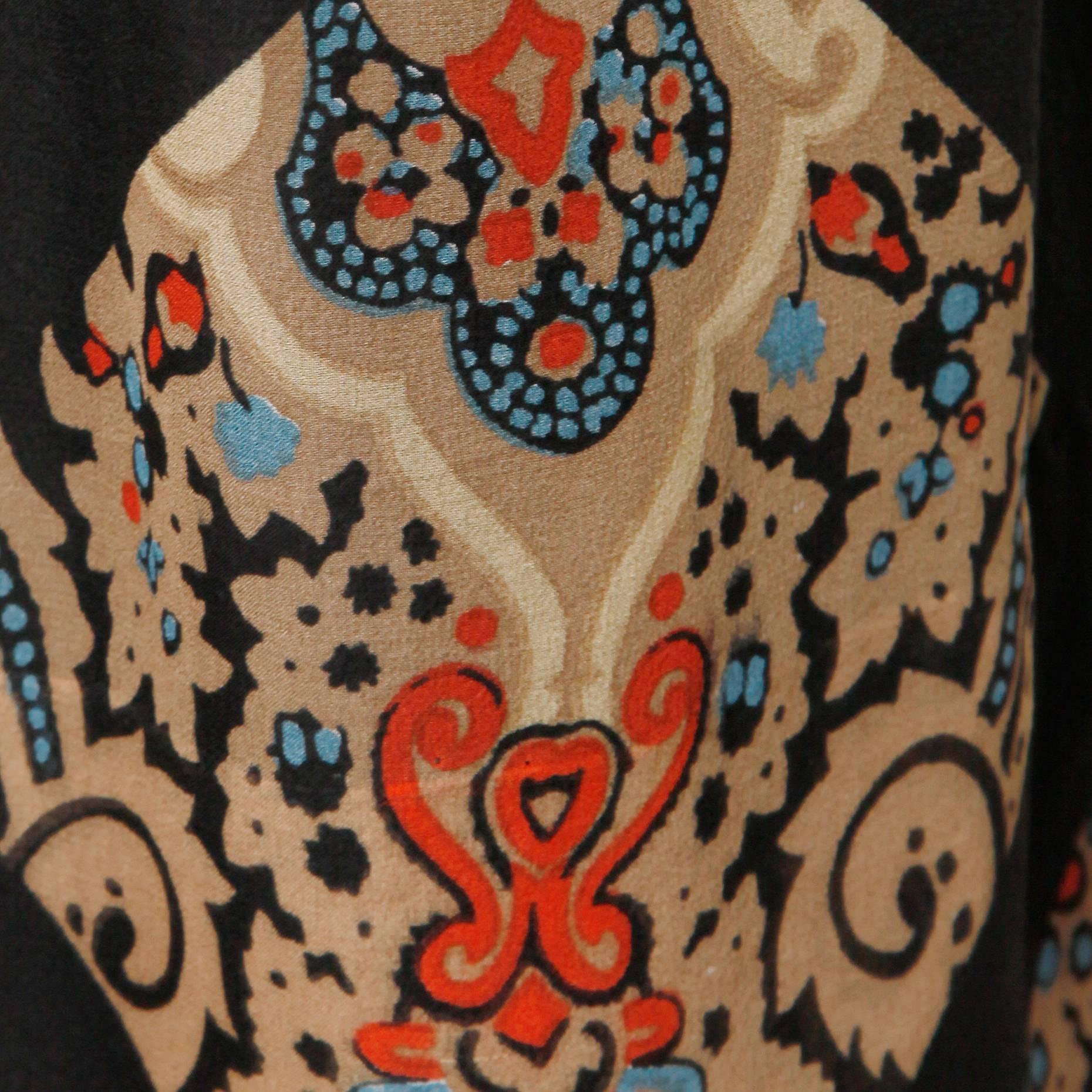 Darling vibrant printed silk dress by Oscar de la Renta with an ascot neck tie and long sheer sleeves. Gorgeous vintage print in black, taupe, red and blue. Rear zip and hook closure. Partially lined. Marked size is a US 8, but it fits more like a