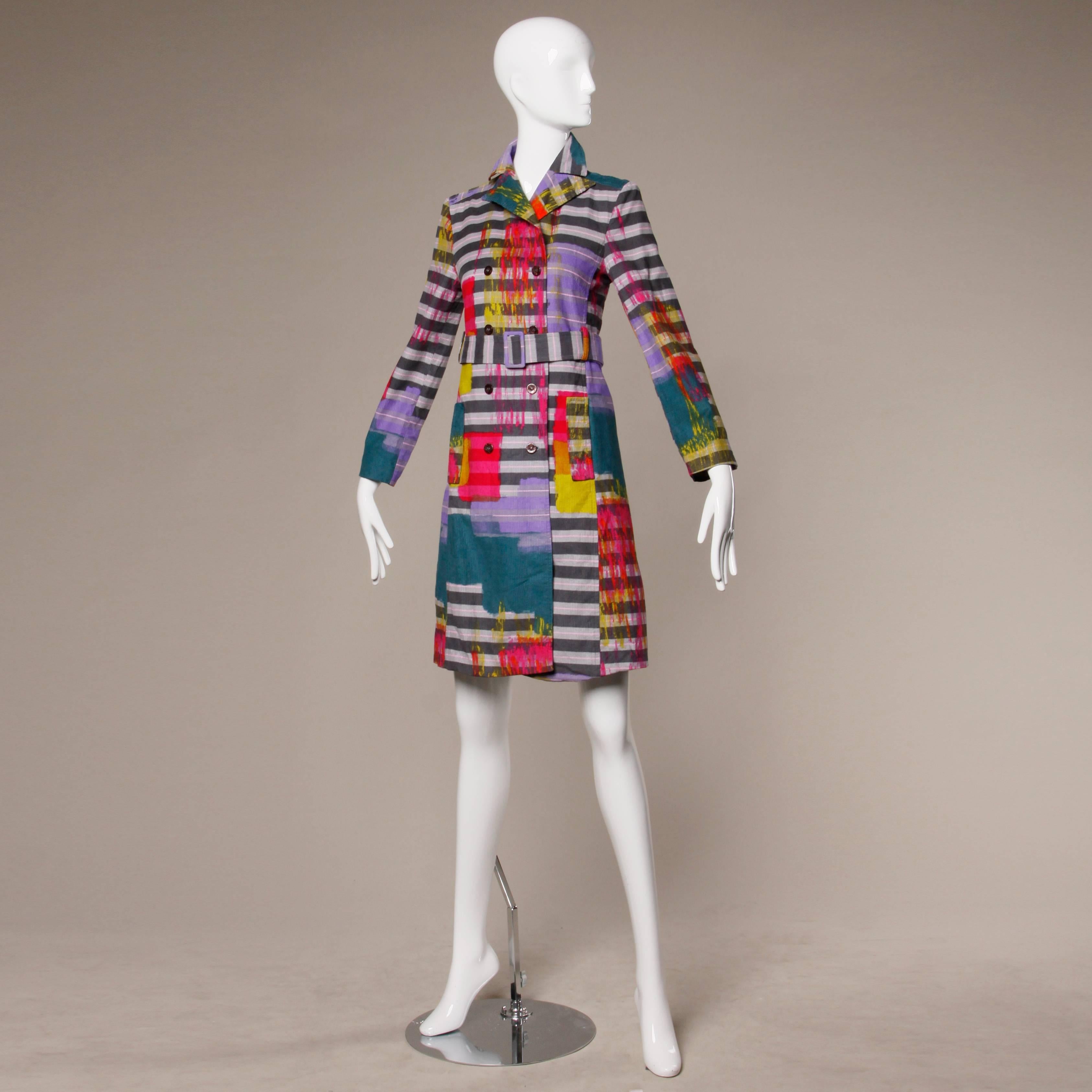 Vibrant neon paint splash striped coat in ultra fine corduroy by Christian Lacroix with matching sash belt. Double breasted button closure. Fully lined. Made in France. Marked size 36 and fits like a modern US small. The measurements are as