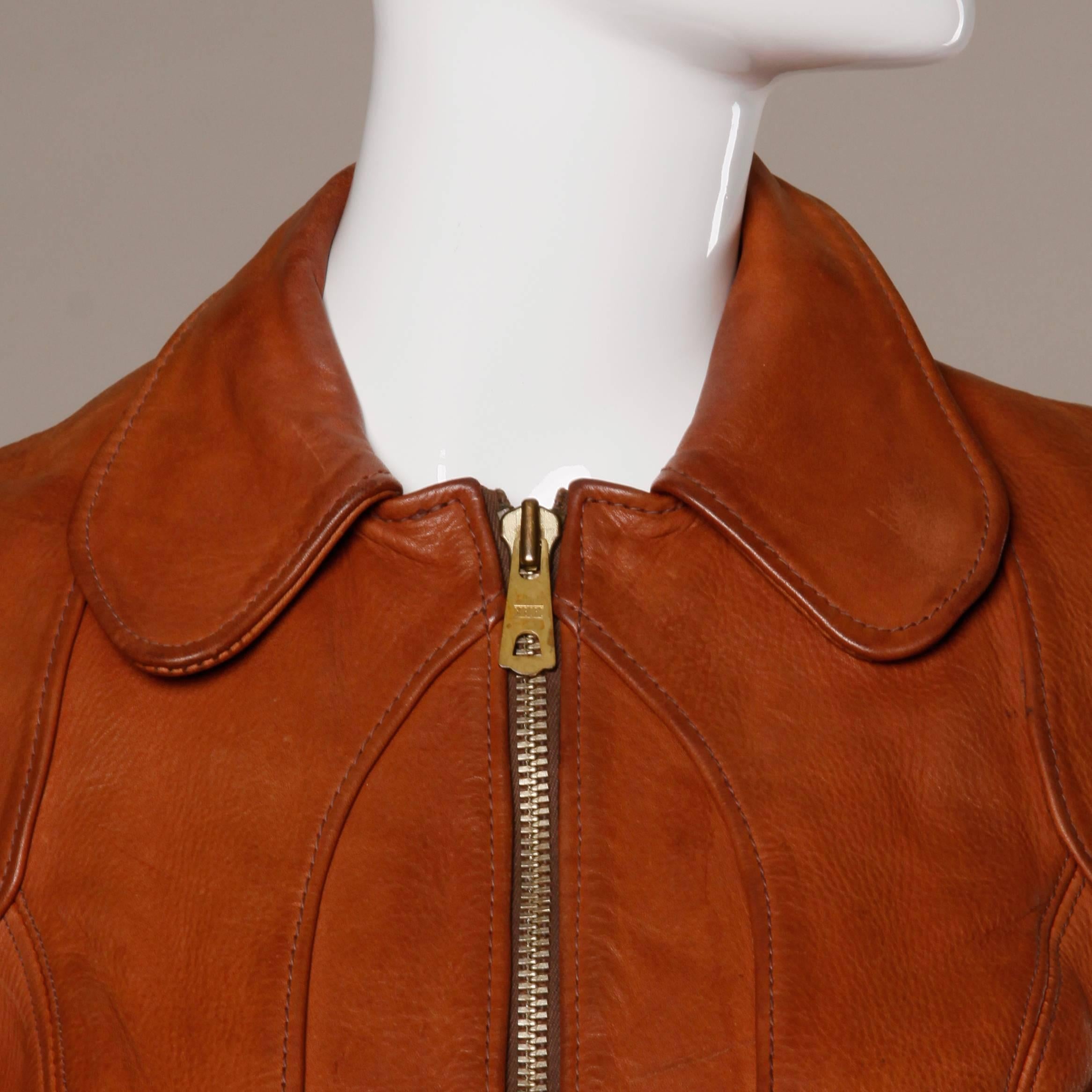 Extremely rare East West Musical Instruments vintage 1970s hand crafted leather fitted jacket. Tiny fit and supple worn in leather with an excellent patina and plenty of wear left in them. Rounded collar and heavy metal zipper. The condition is