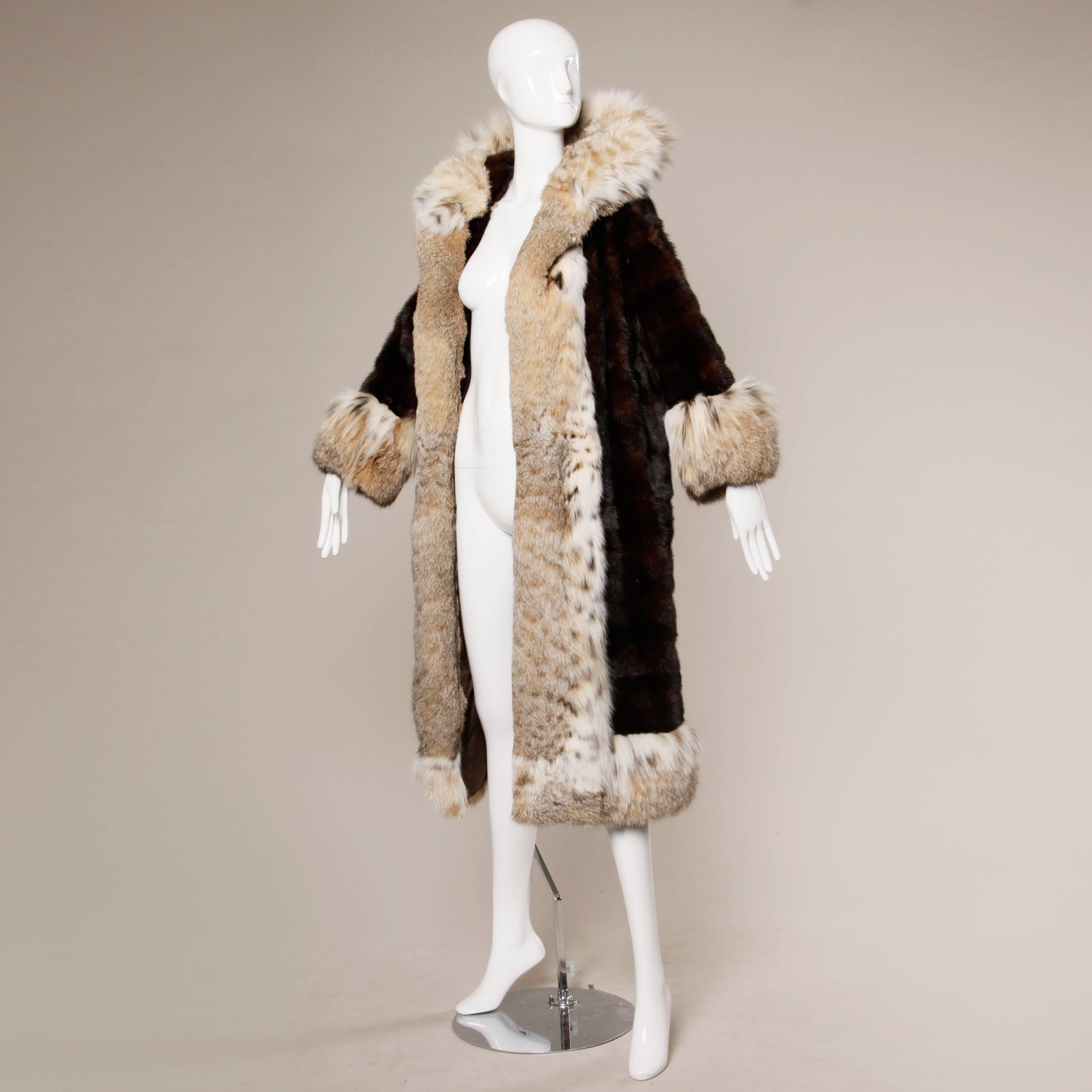 Reduced from $3500! Absolutely stunning horizontal mahogany mink fur coat with luxe spotted Lynx fur trim, cuffs and pop up collar. Fur is in excellent condition. Mink is shiny and plush. Lynx is fluffy, full and soft. A gorgeous