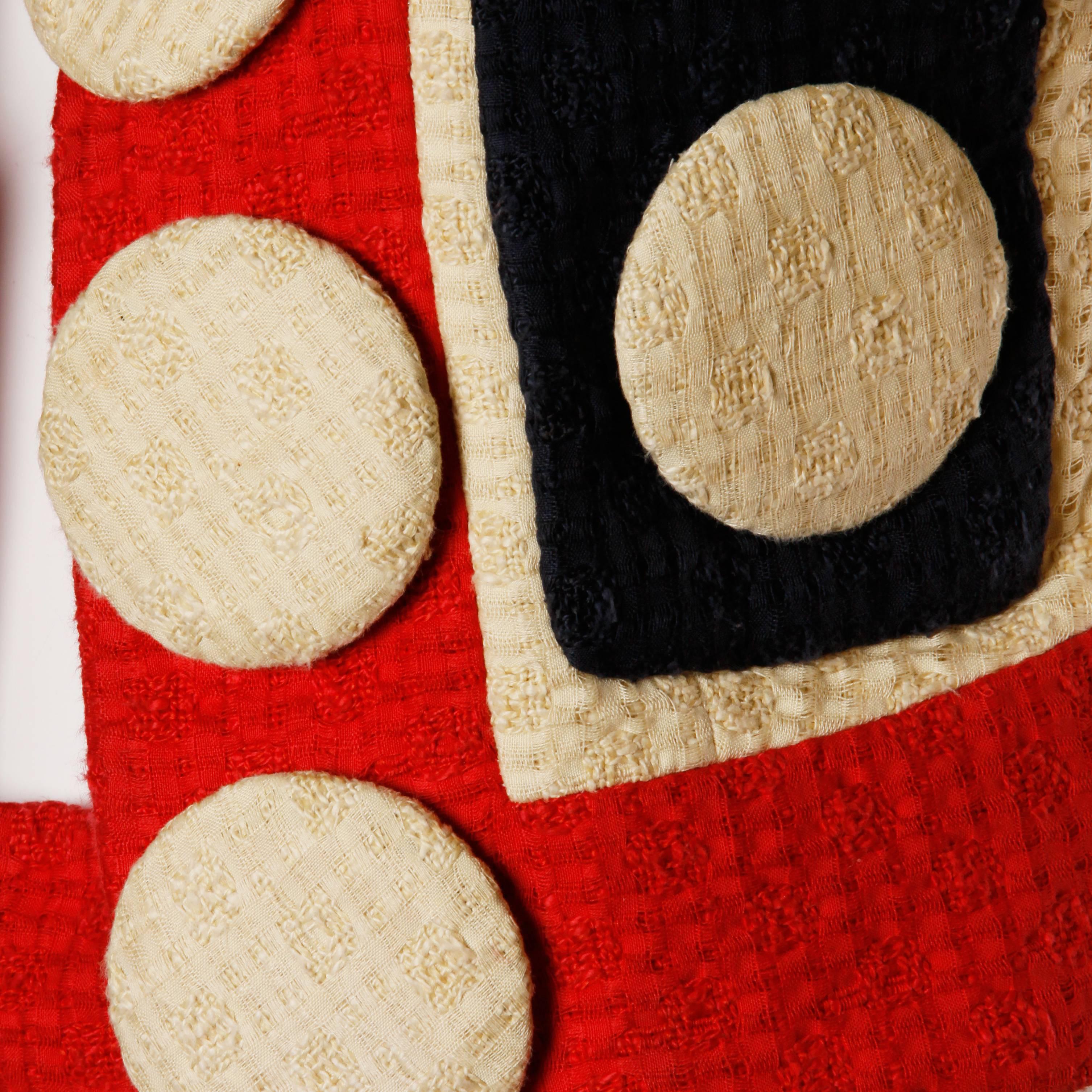 Phenomenal Franco Moschino designed skirt suit with oversized buttons from 1990. Linen and jute plain-weave double cloth. Red, blue and cream fabric. This ensemble is in the clothing collection at Los Angeles County Museum of Art, LACMA and remains