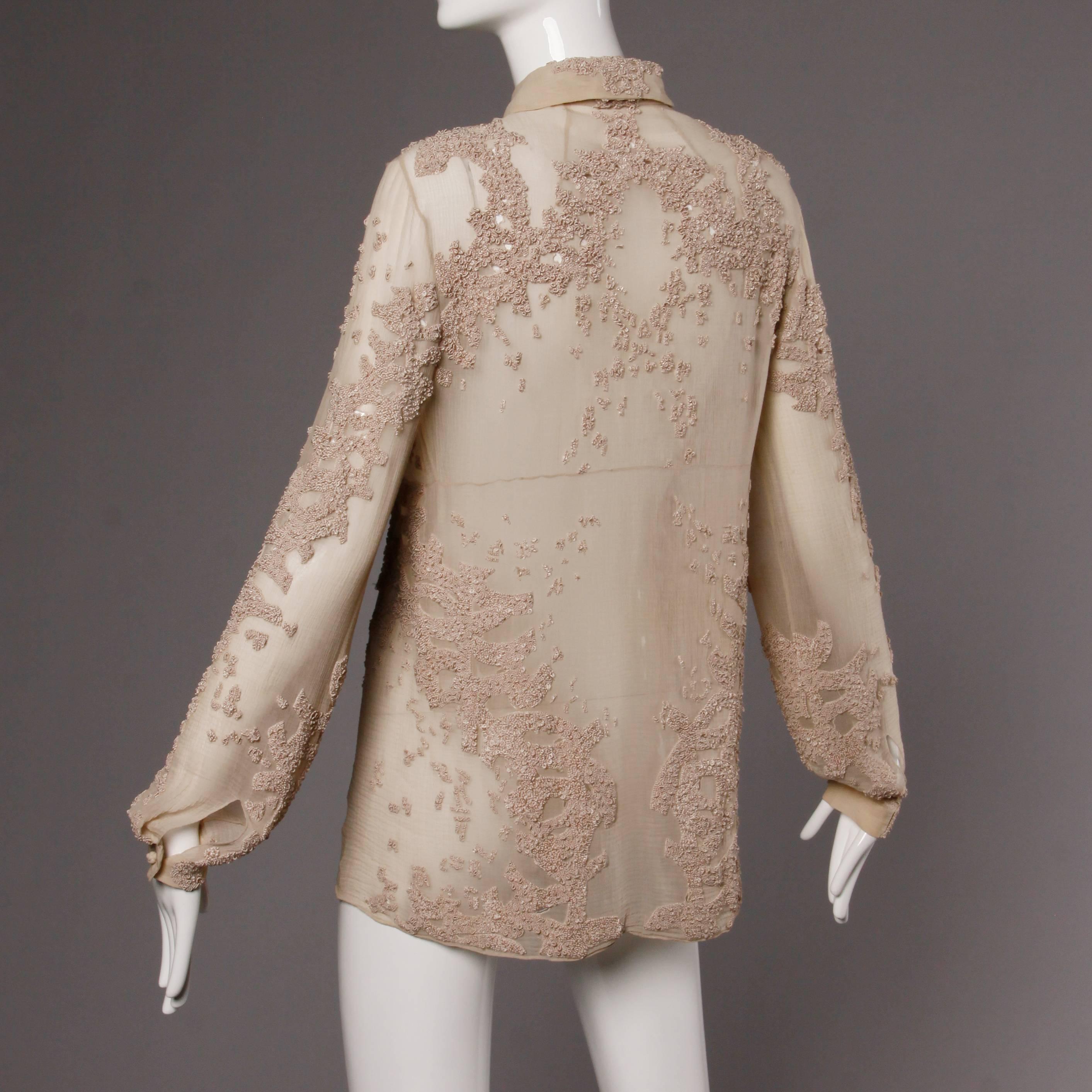 Stunning nude silk button up blouse by Ralph Rucci's line Chado. Tiny cut out detailing with hand embroidery. Unique design. Completely sheer. This top will fit a modern size medium-large.