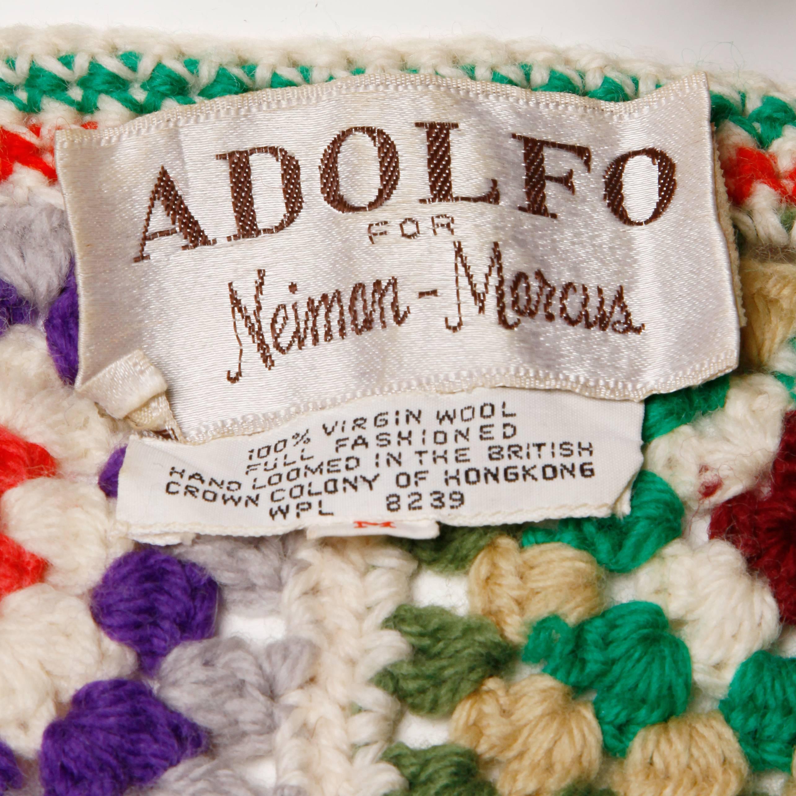 Vibrant wool vest or top in hand crocheted Granny Squares by Adolfo for Neiman Marcus. Unlined. Made in the British Crown Colony of Hong Kong. The marked size is medium and the piece fits like a modern small-medium. The bust measures 32-36