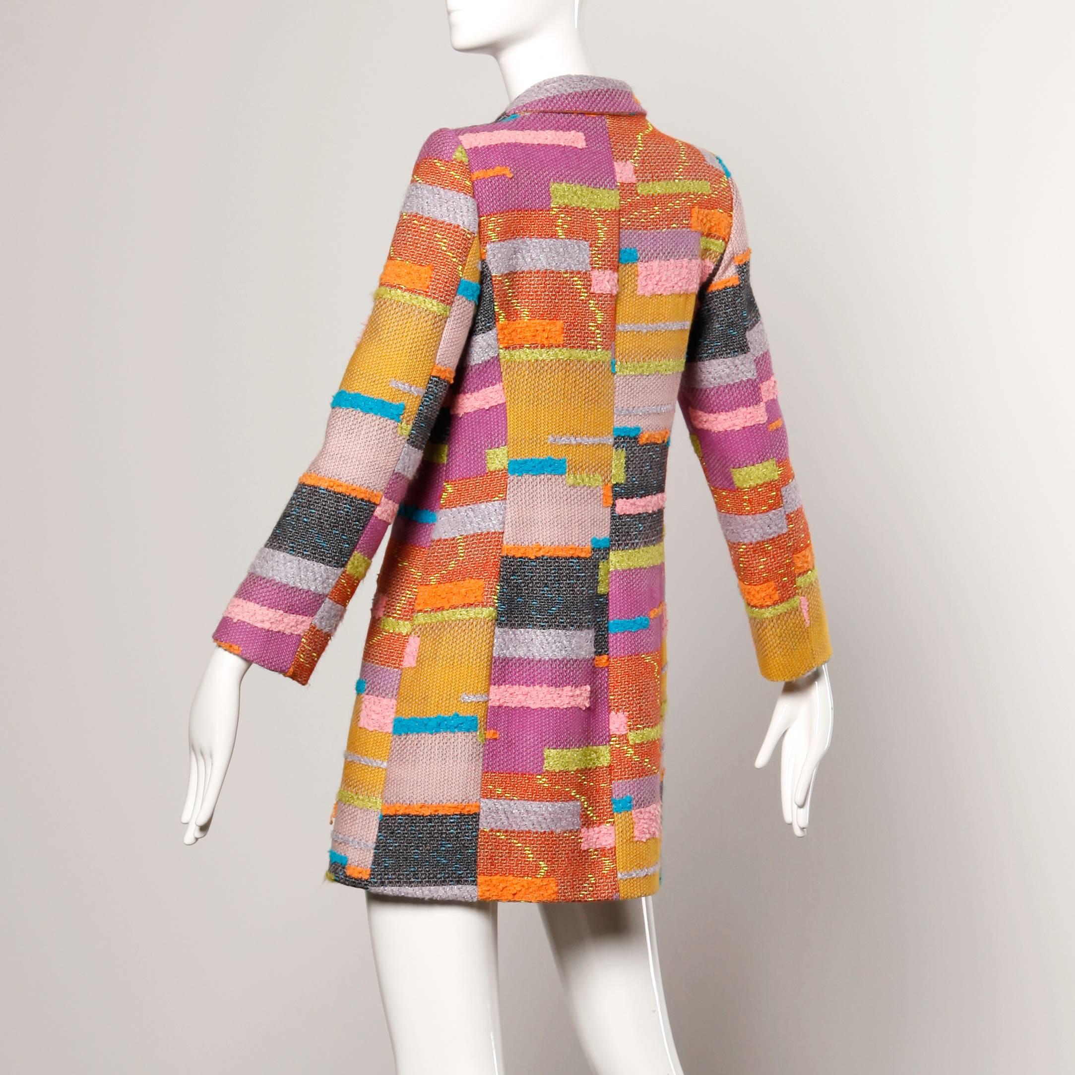 Light weight color block coat by Christian LaCroix in colorful woven fabric. Fully lined. Front button closure. Fabric content is 73% wool, 15% cotton, 8% rayon, 4% poly. Made in France. Marked size 38. Fits like a modern size small-medium. The