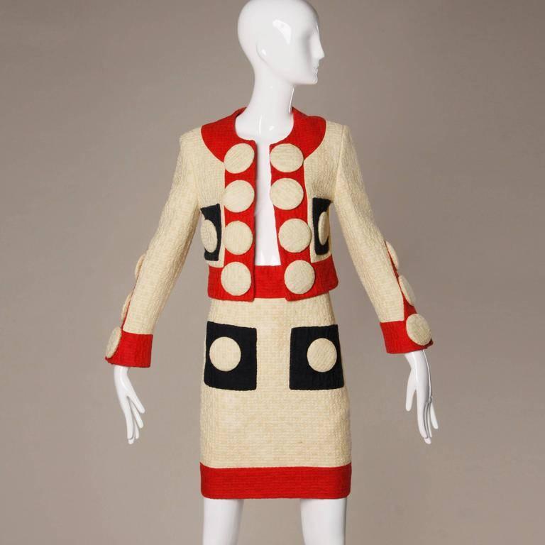 Phenomenal Franco Moschino designed skirt suit with oversized buttons from 1990. Linen and jute plain-weave double cloth. Red, blue and cream fabric. This ensemble is in the clothing collection at Los Angeles County Museum of Art, LACMA and remains