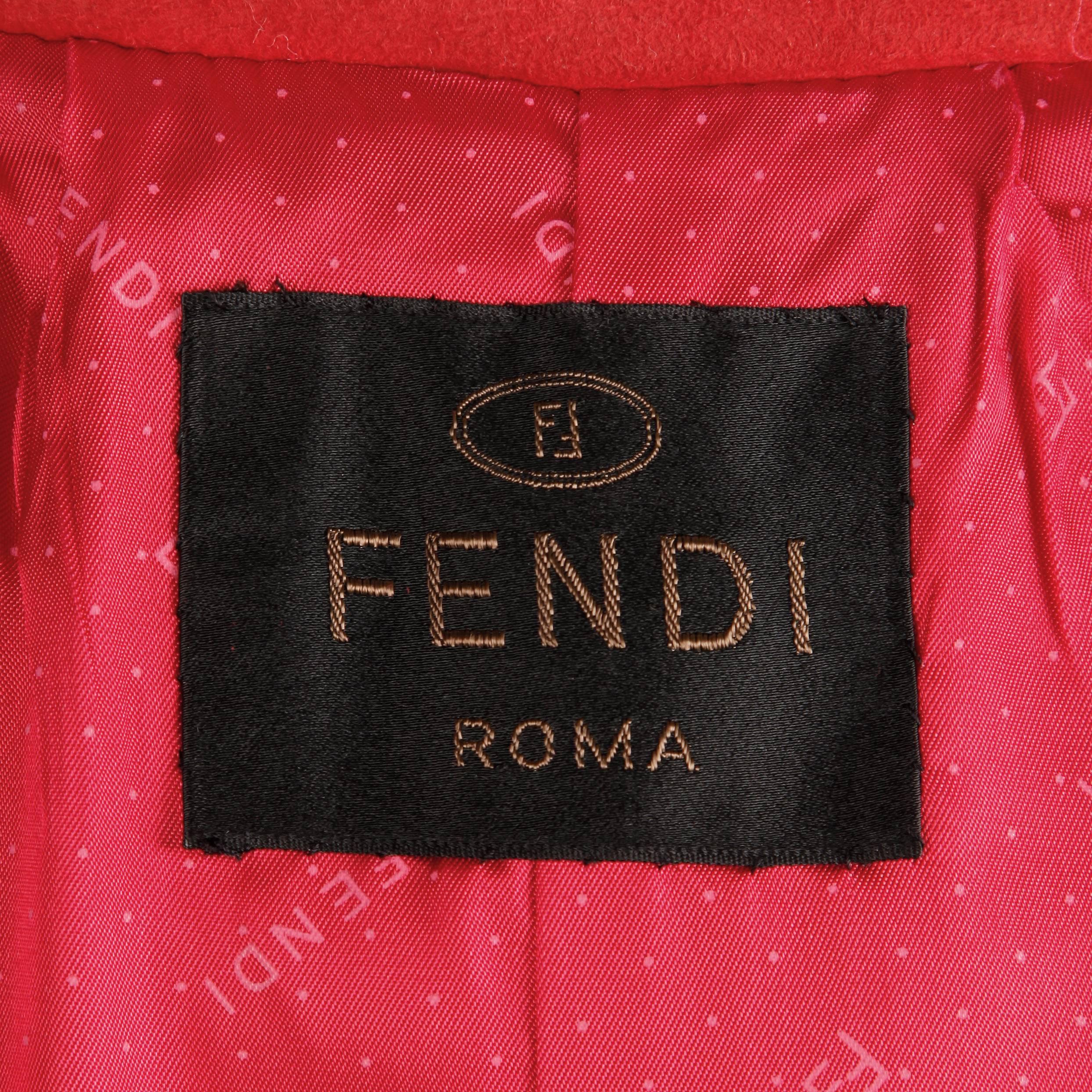 Gorgeous soft red suede leather coat by Fendi with matching sash belt. Fully lined in Fendi logo fabric. Side pockets and front button closure. The marked size is 8 and the coat fits true to size. The measurements are as follows:
Bust: 38