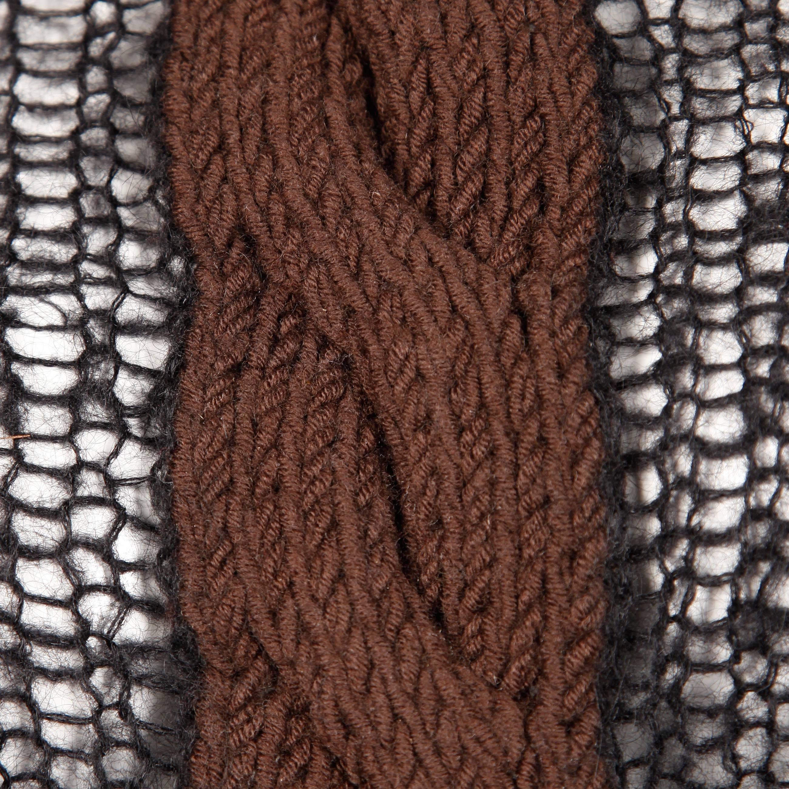 Unique vintage black and brown cable knit halter top sweater by Laura Biagiotti. The top is unlined and is see through on the black portion of the knit. It ties up the back (fully adjustable fit) and buttons on the back of the neck with three