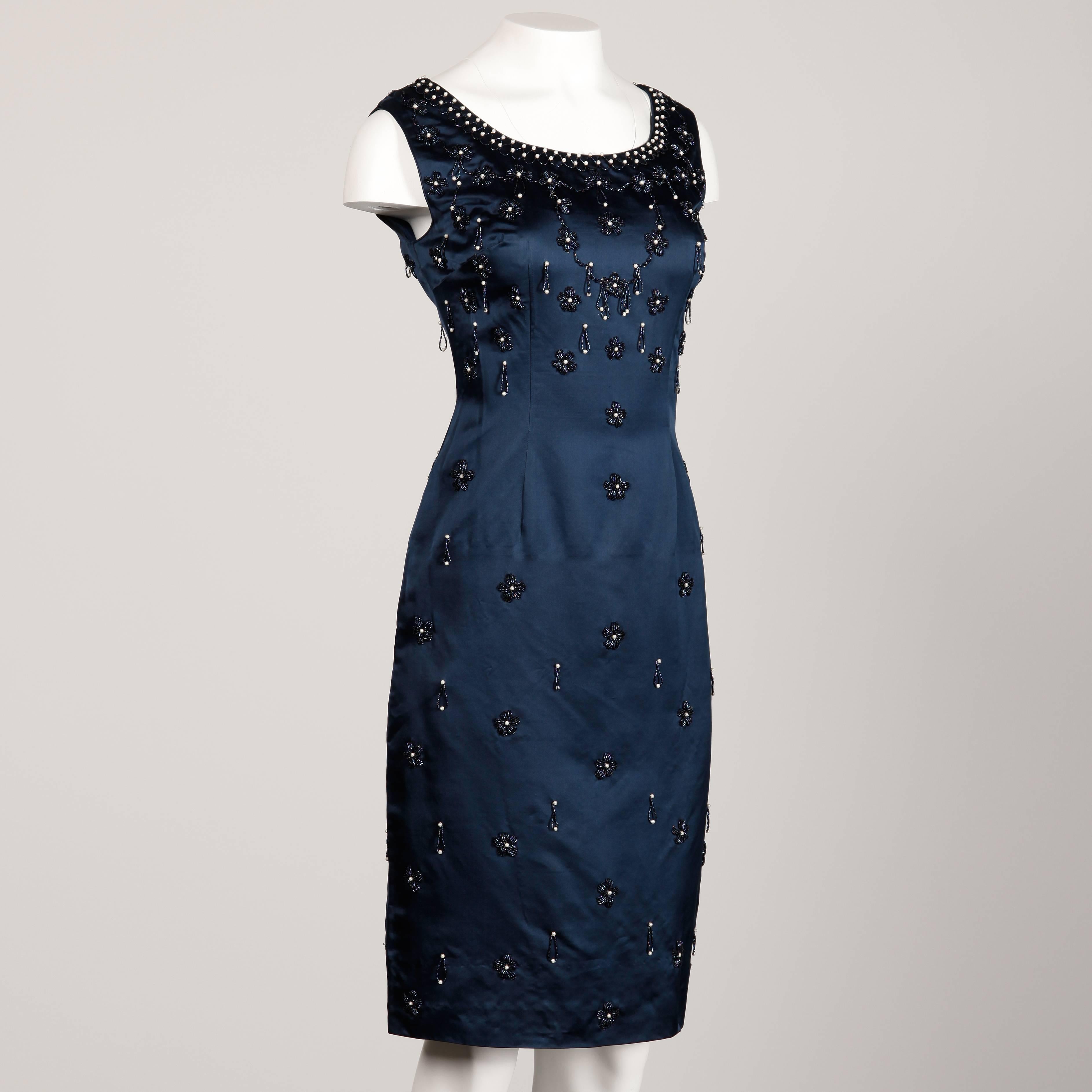 Elegant deep blue silk satin cocktail dress with allover beadwork. Fully lined in blue silk with rear metal zip closure. Gorgeous quality and condition! This dress has no marked size, but it fits like a modern size medium. The bust measures