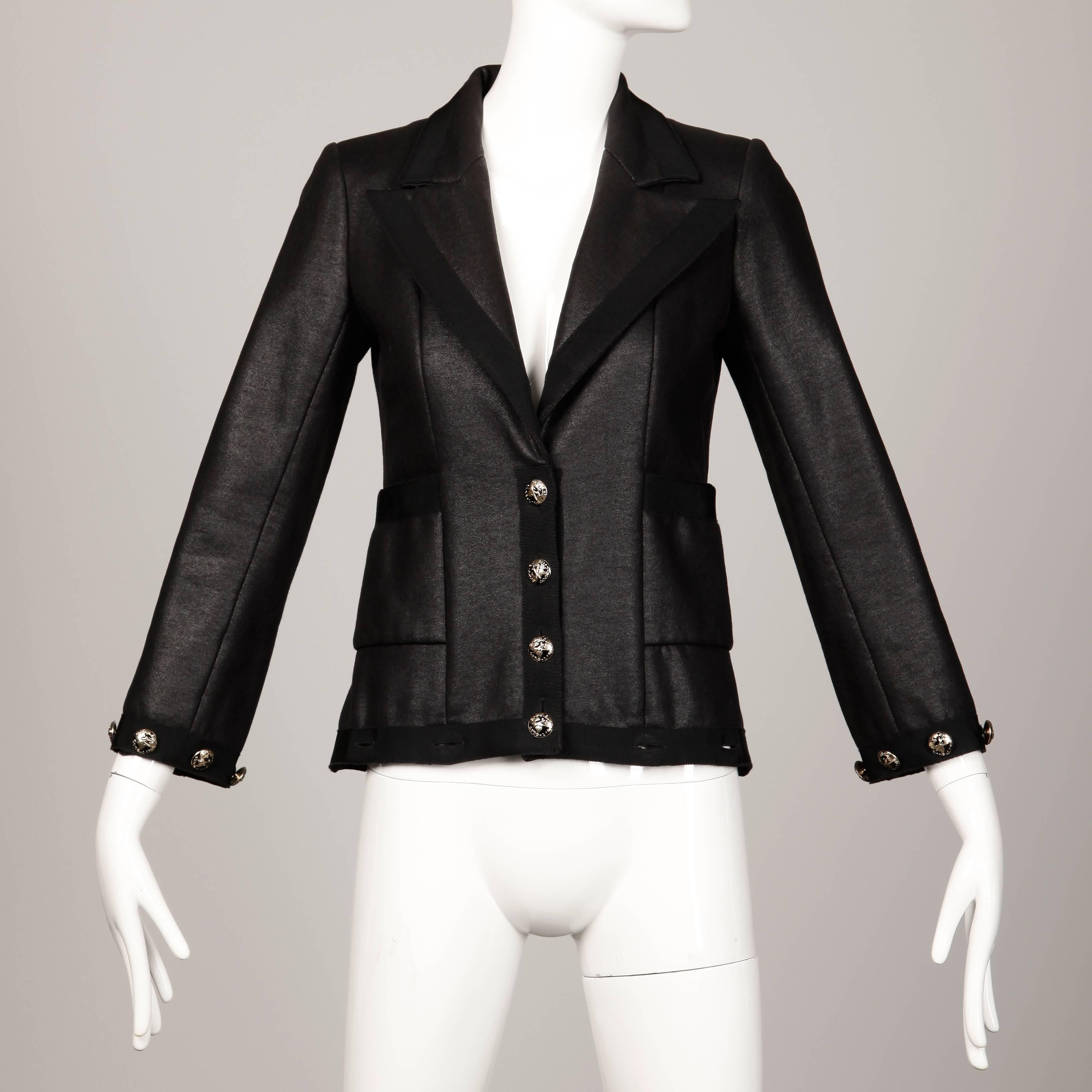 Stunning black Chanel coat that converts to a jacket by buttoning off the bottom panel! From Chanel's 2008 
