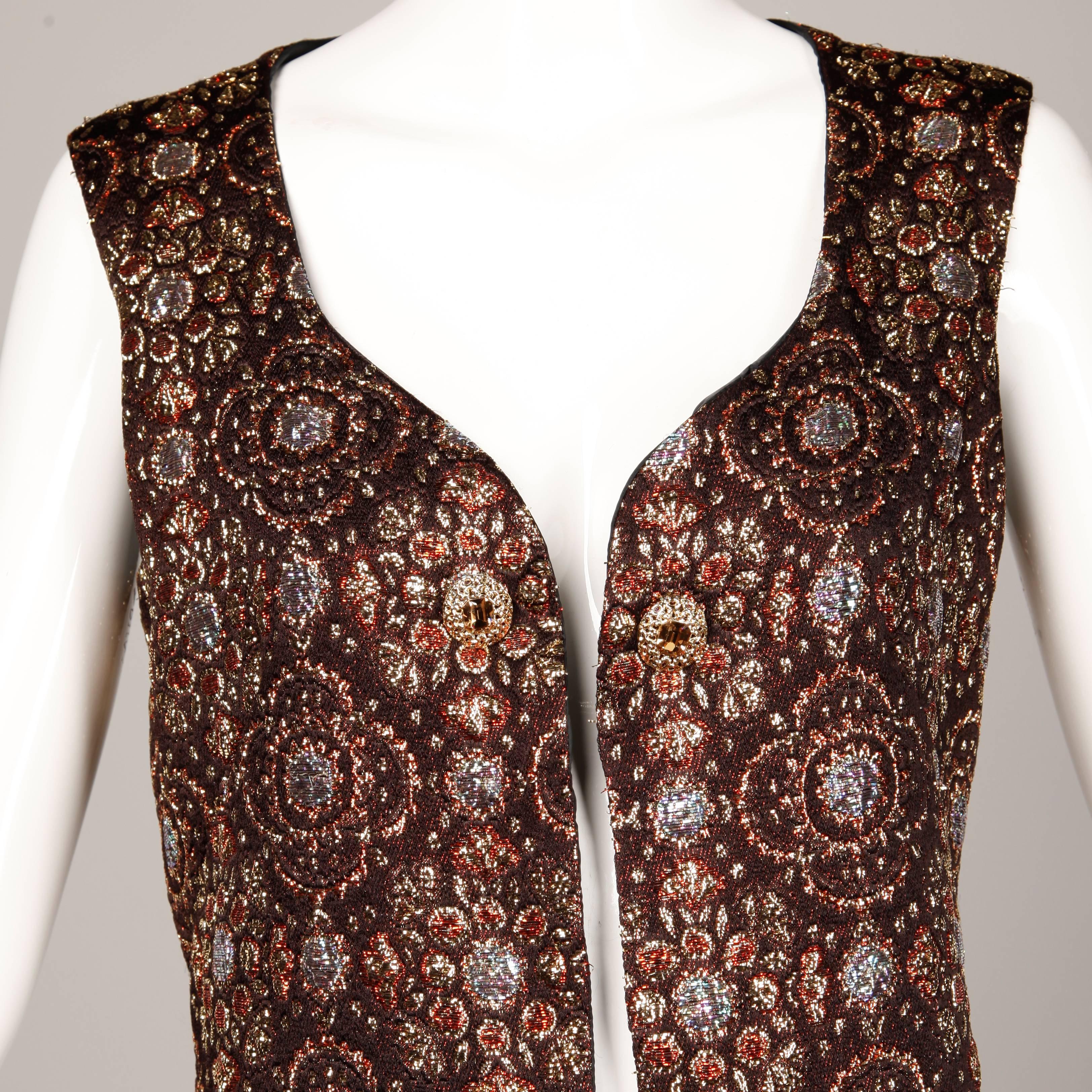 Handmade vintage metallic brocade maxi vest with rhinestone detail near the neckline. Fully lined with no closure (hangs open). There is no marked size but the vest fits up to a modern size large and any size smaller. The bust measures 38" and