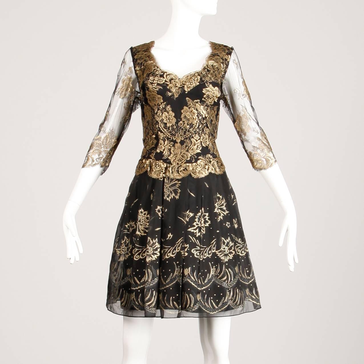 Stunning vintage black and metallic gold lace and silk dress by Zandra Rhodes. Hand painted skirt and sheer sleeves. Fully lined with rear zip and hook closure. The marked size is medium and the dress fits true to size. The bust measures 36".