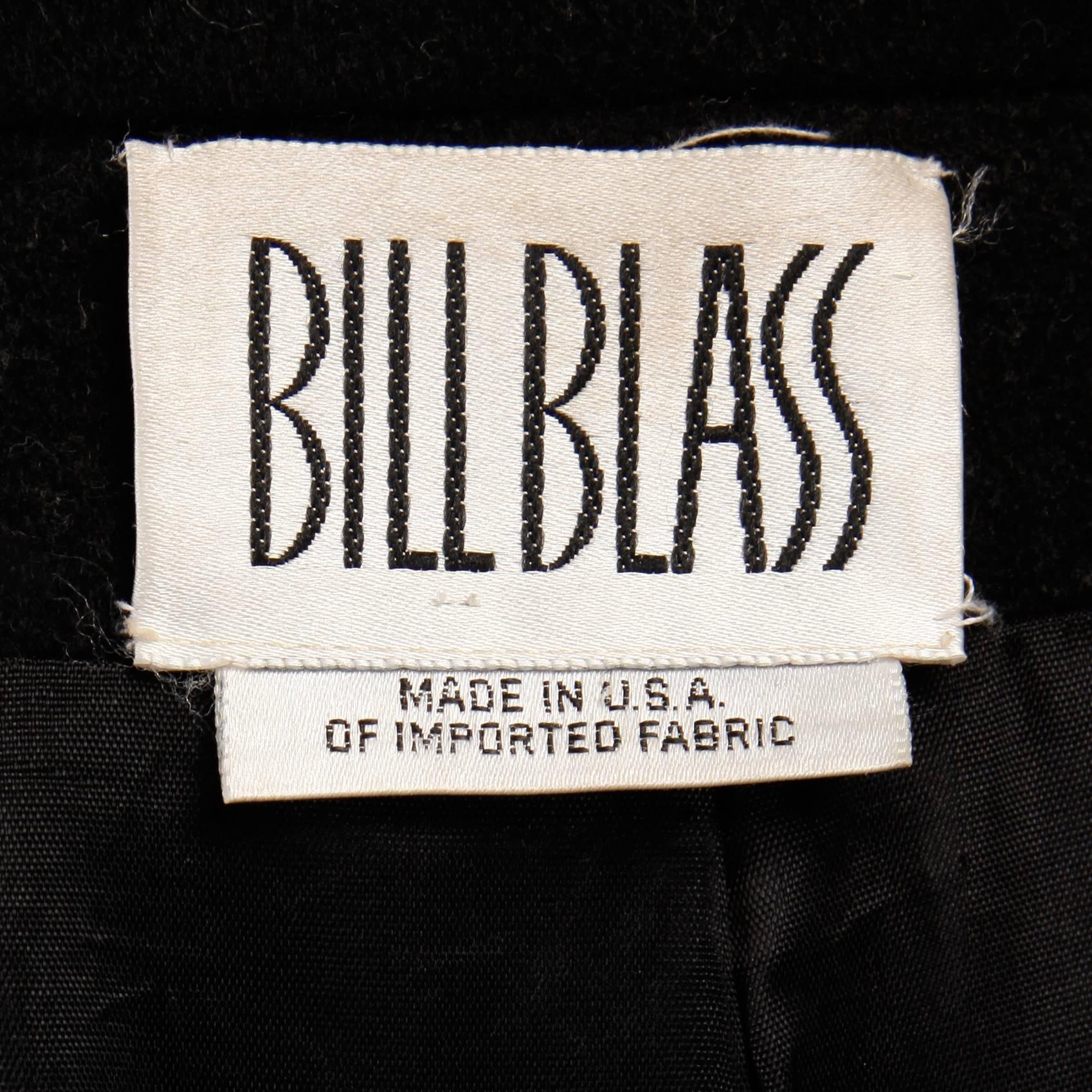 Stunning vintage black wool maxi coat by Bill Blass. Double breasted military buttons and epaulettes. Fully lined with front button closure. This coat fits like a modern size medium-large. The bust measures 39", waist 34", hips 46",
