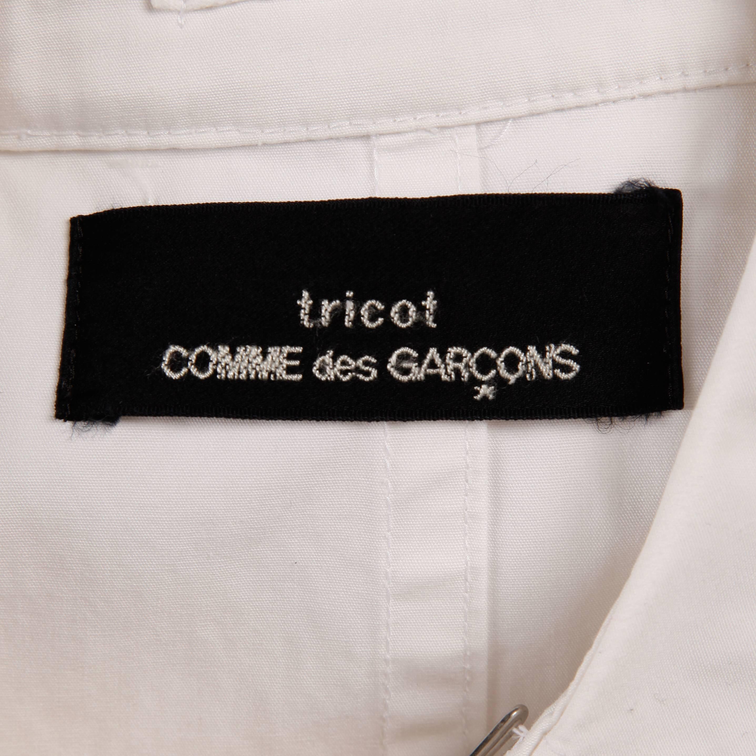 Vintage Comme des Garcons white cotton double breasted jacket from the 1998 collection. Hook closure at the collar. Unlined. The jacket fits like a modern size small. The bust measures 36