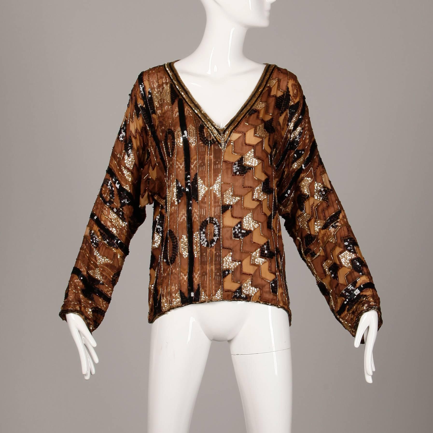 Gorgeous vintage Judith Ann brown block printed silk top with sequin and beadwork. Unlined with no closure (pulls on over the head). 100% silk. The marked size is large, but will also fit sizes small-medium due to the oversized fit. The bust