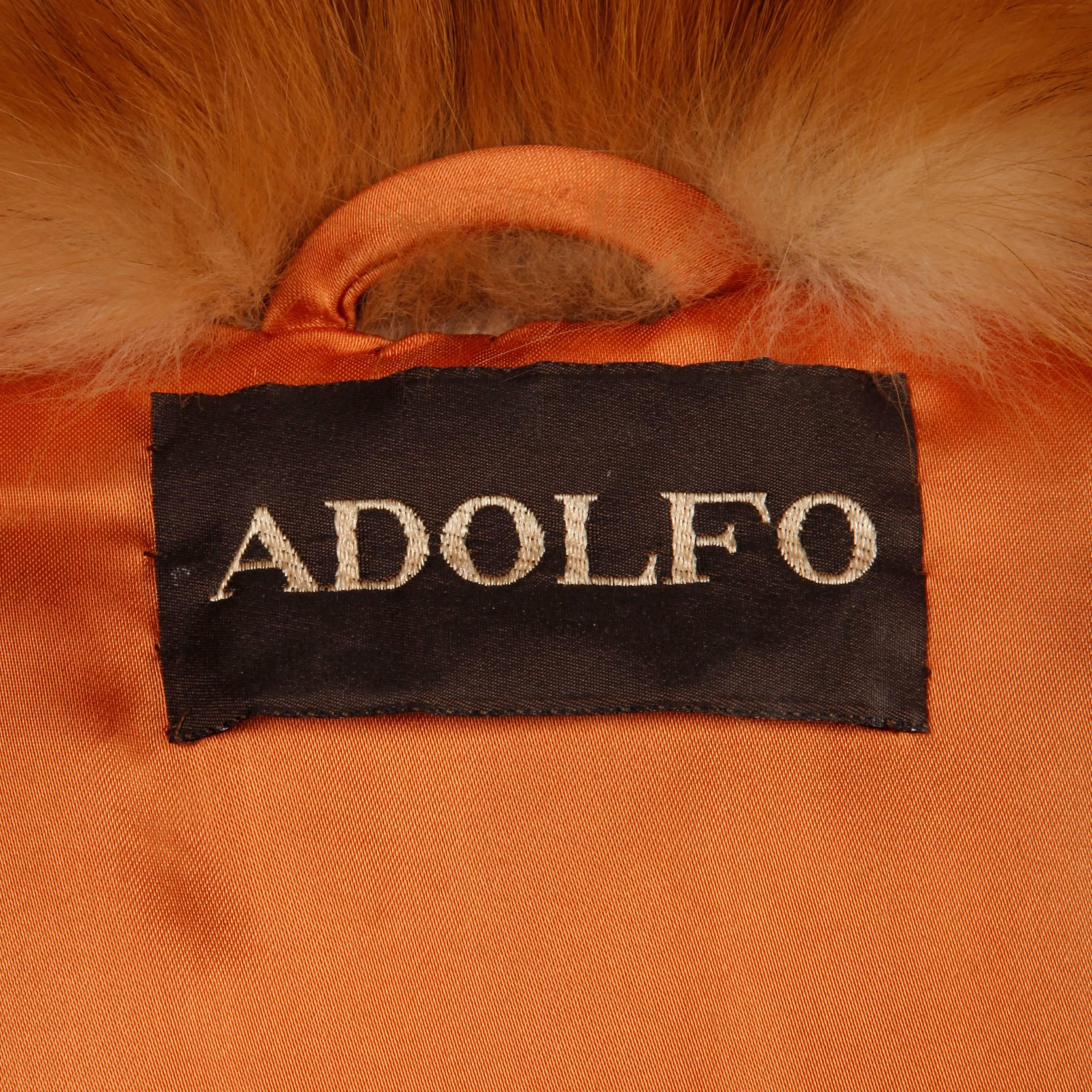 Absolutely breathtaking vintage red fox fur coat by Adolfo in beautiful condition. The coat is fully lined with front hook closure and no monogram. Fits a modern size large-XL. The bust measures 48