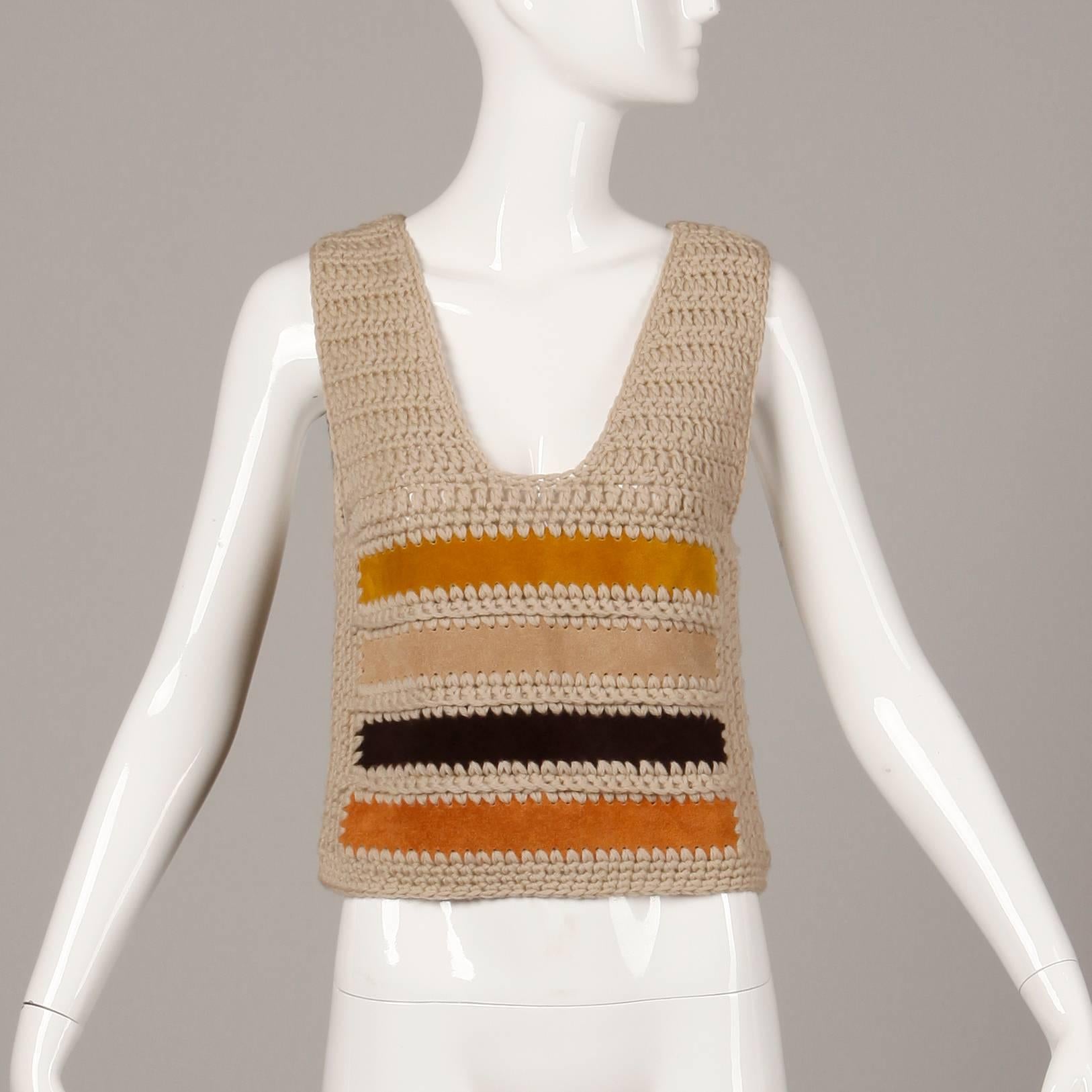 Vintage 1970s color block sweater vest by Saks Fifth Avenue with genuine suede leather stripes. Unlined with no closure (pulls on over head). 100% wool with suede leather stripes. Fits like a modern size small-medium. Measurements taken unstretched.