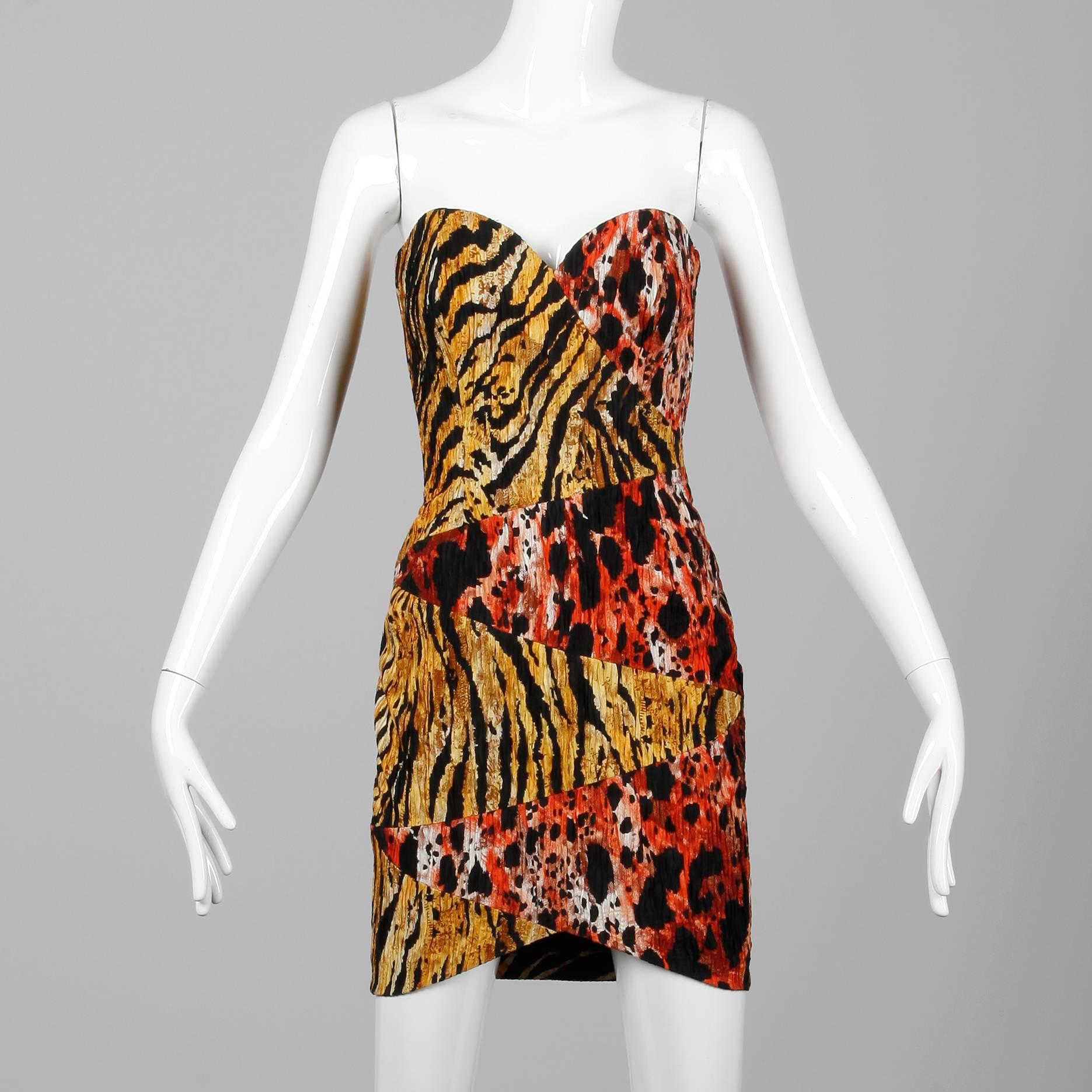 Sexy vintage mini dress in two tone animal prints by Mila Schon. Fully lined with side zip and hook closure. The marked size is 42 and the dress fits like a modern XS. The bust measures 35", waist 24", hips 35", and the total length