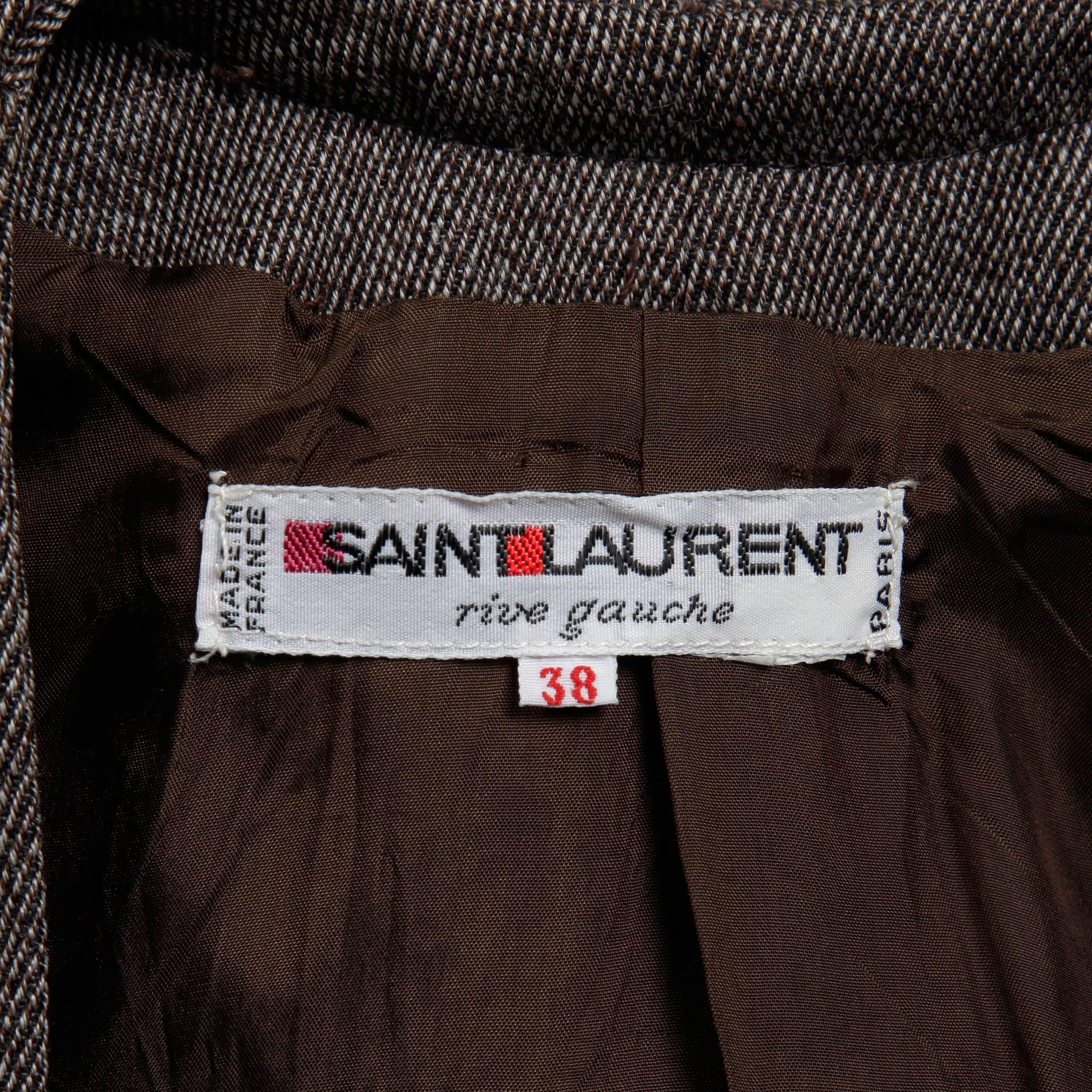 Vintage Yves Saint Laurent cropped bolero jacket in brown wool tweed. Fully lined with no closure (hangs open). Structured shoulder pads are sewn in underneath the lining. The marked size is 38, and the jacket fits like a modern medium. The bust
