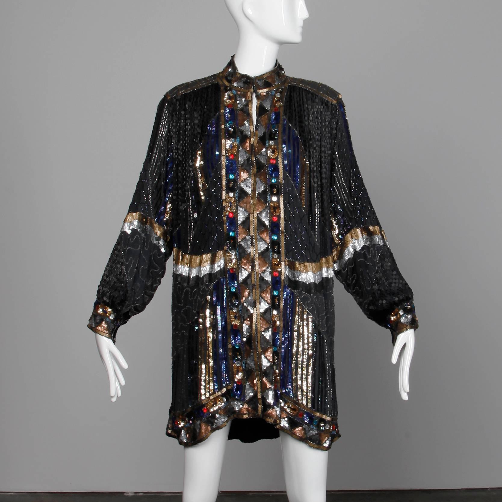 Heavily embellished silk jacket or coat with beading, sequins and rhinestones. Fully lined with front hook closure and snap closure on wrists. Structured shoulder pads can easily be removed if desired. 100% silk, with 100% rayon lining. Free size.