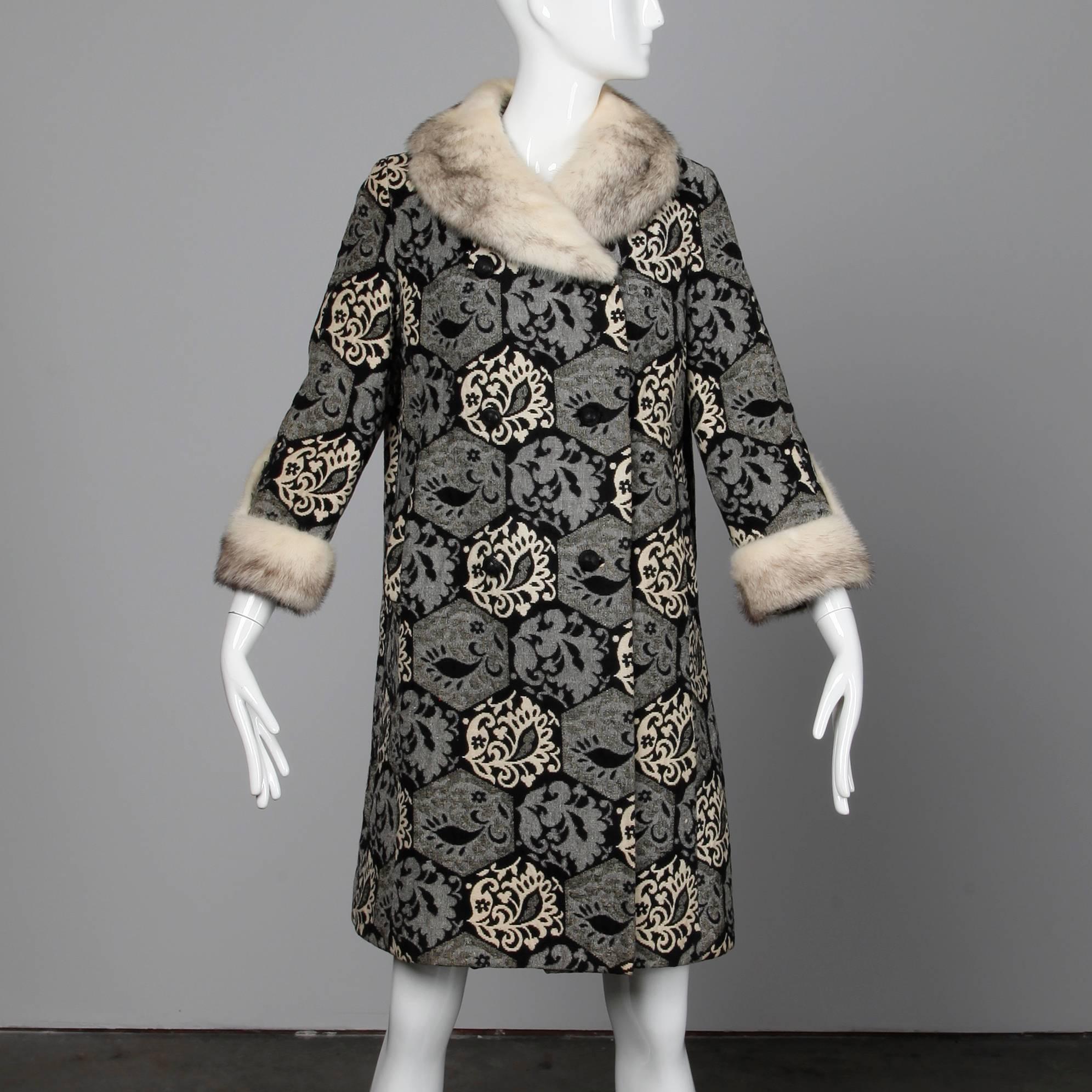 Gorgeous vintage wool tapestry coat with cross mink fur collar and cuffs by Evans. Fully lined with front button and snap closure. Hidden side pockets. Fits like a size small-medium. The bust measures 40", waist 40", hips 46",