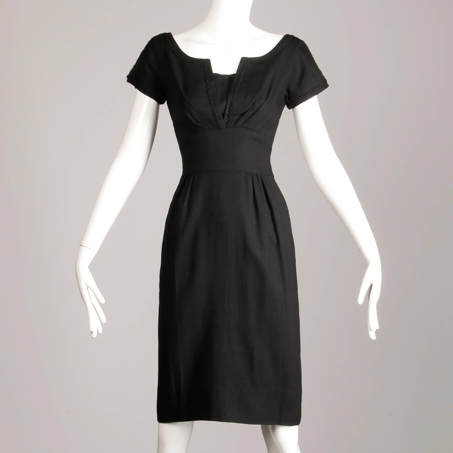 Flattering vintage 1950s sheath dress with shelf bust by Peck & Peck. Unlined with rear metal zip and hook closure. The bust measures 36