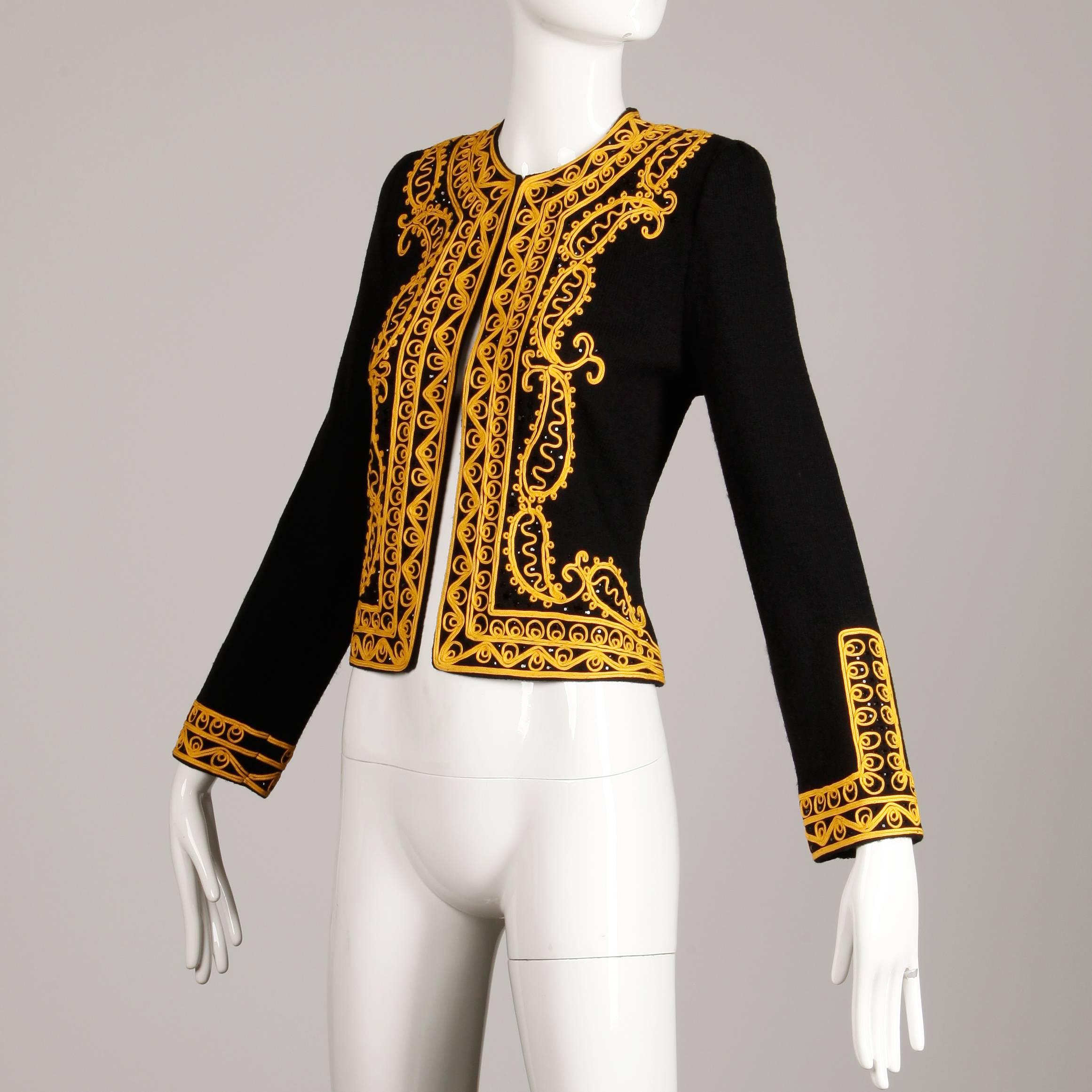 Military-inspired vintage knit cardigan sweater or jacket by Adolfo with gold soutache embroidery and beadwork. Unlined with front hook closure. External shoulder pads can easily be removed if desired. 70% wool, 30% rayon. Fits like a modern size