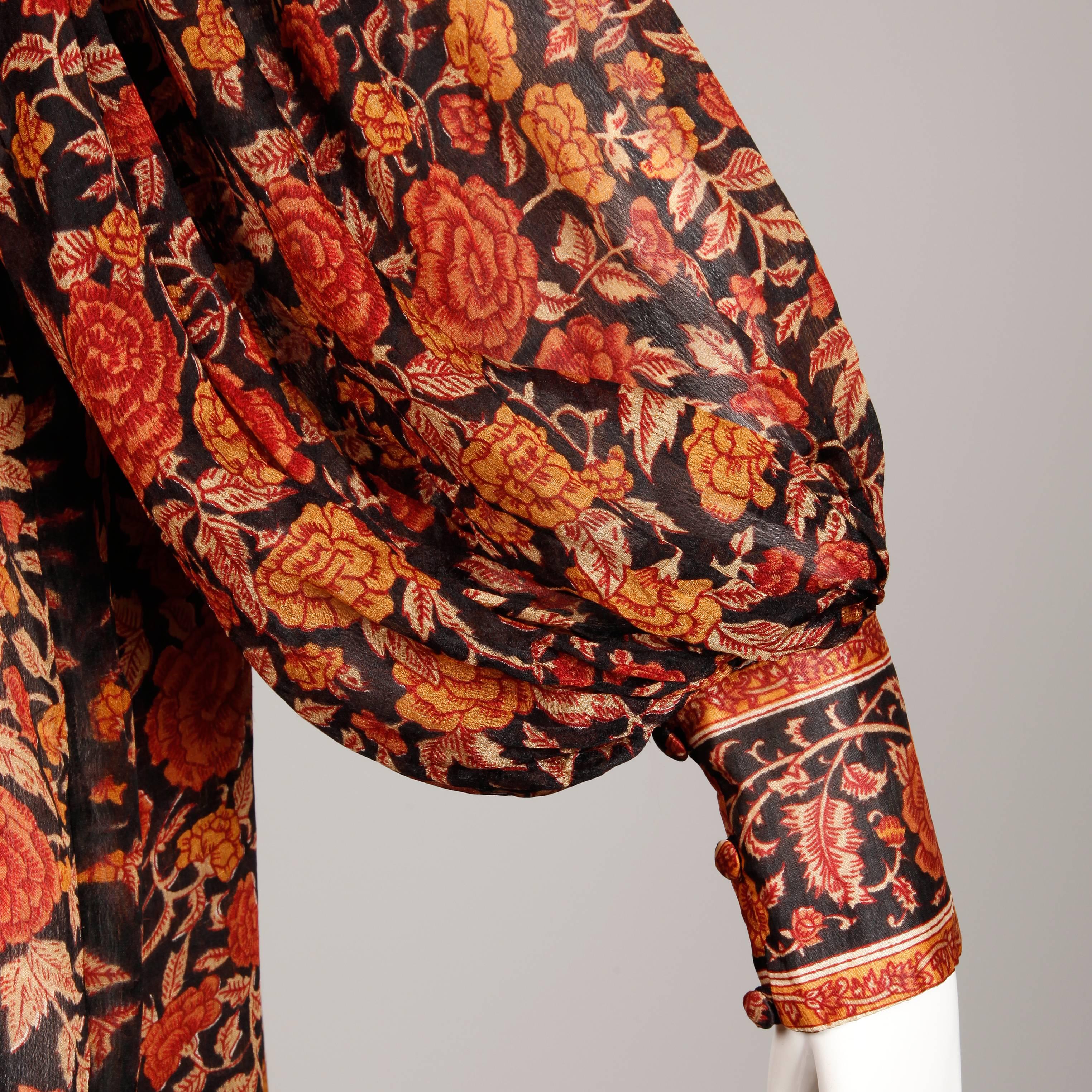 Absolutely stunning paper thing silk dress with a hand block printed Indian design by Ritu Kumar for Judith Ann. Billowy balloon sleeves and soft delicate creamy silk fabric. Just gorgeous! Unlined with front tie closure and button closure at