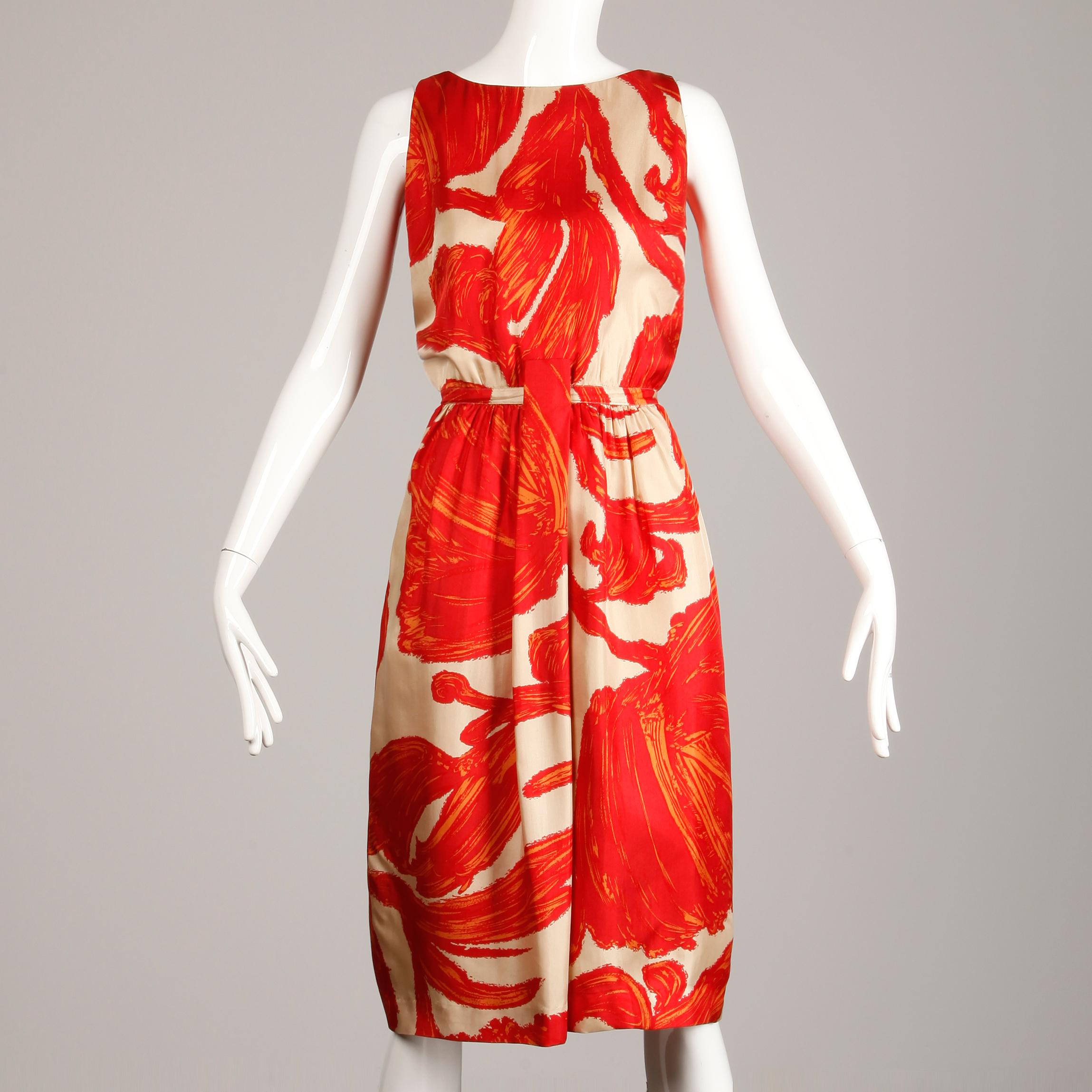 Gorgeous 1960s silk sheath dress by B.H. Wragge with a 1963 label and a midcentury print. Fully lined with rear zip and hook closure. Hidden side pockets and front belt loop (no belt included). Fits like a modern size medium. The bust measures 43