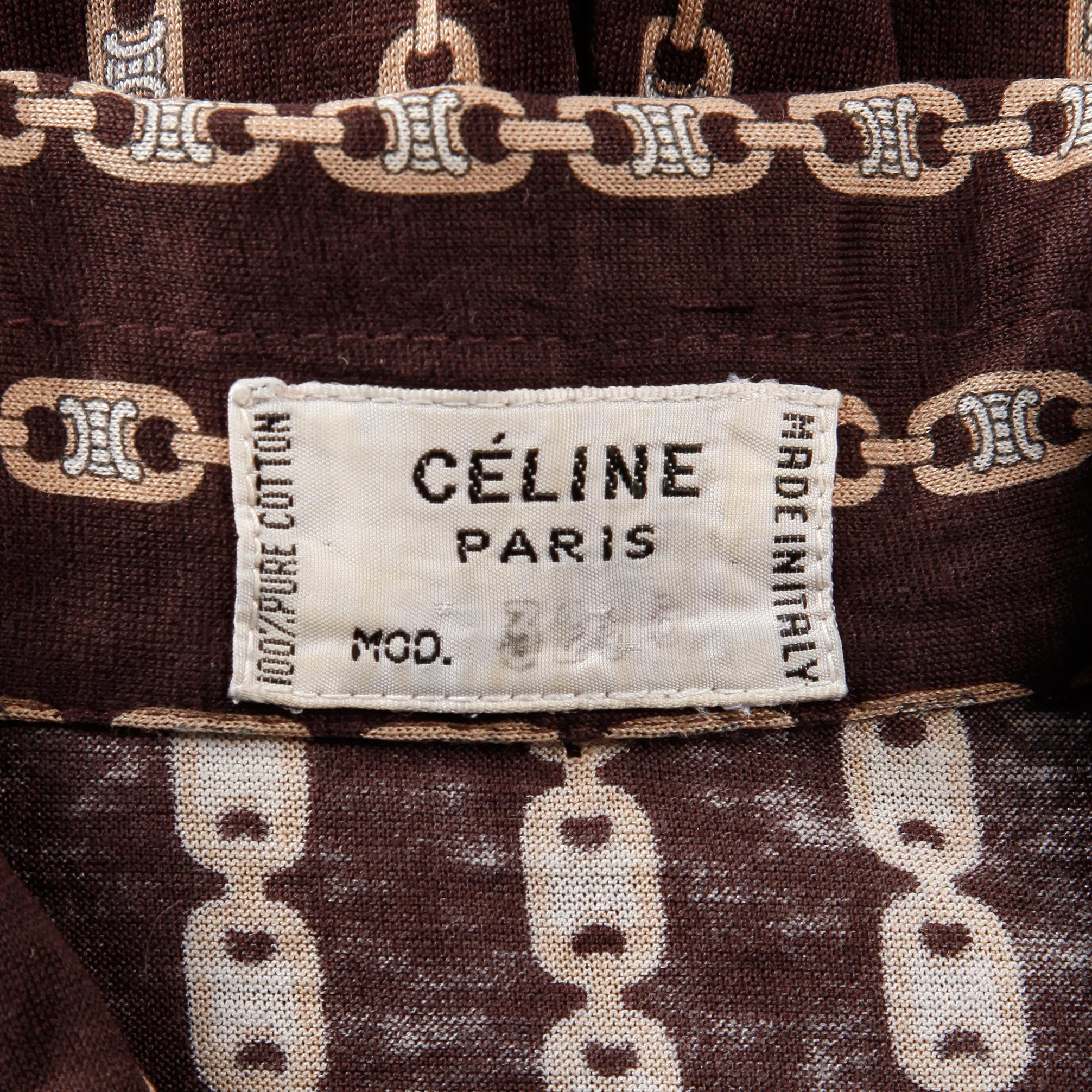 Fantastic vintage 1970s blouse by Celine Paris with iconic equestrian horse bit and monogram print. Numbered label. Unlined with front button closure and button closure at wrists. The marked size is 38, but the blouse fits like a modern size XS-S.