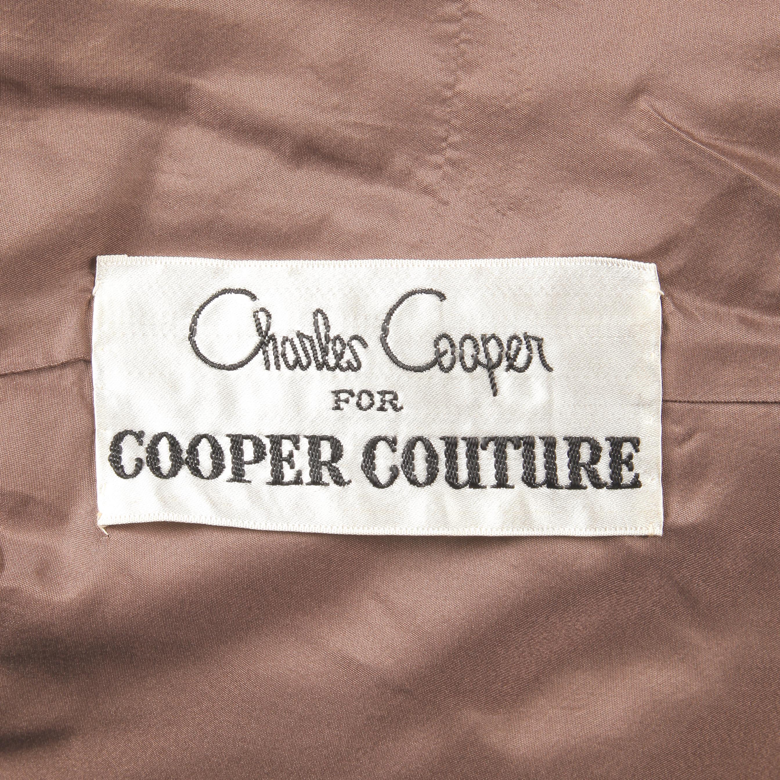 Gorgeous brown velvet vintage 1960s coat by Charles Cooper for Cooper Couture at Nan Duskin. Fully lined with front cabachon button closure. Side pockets. Fits like a modern size large. The bust measures 46