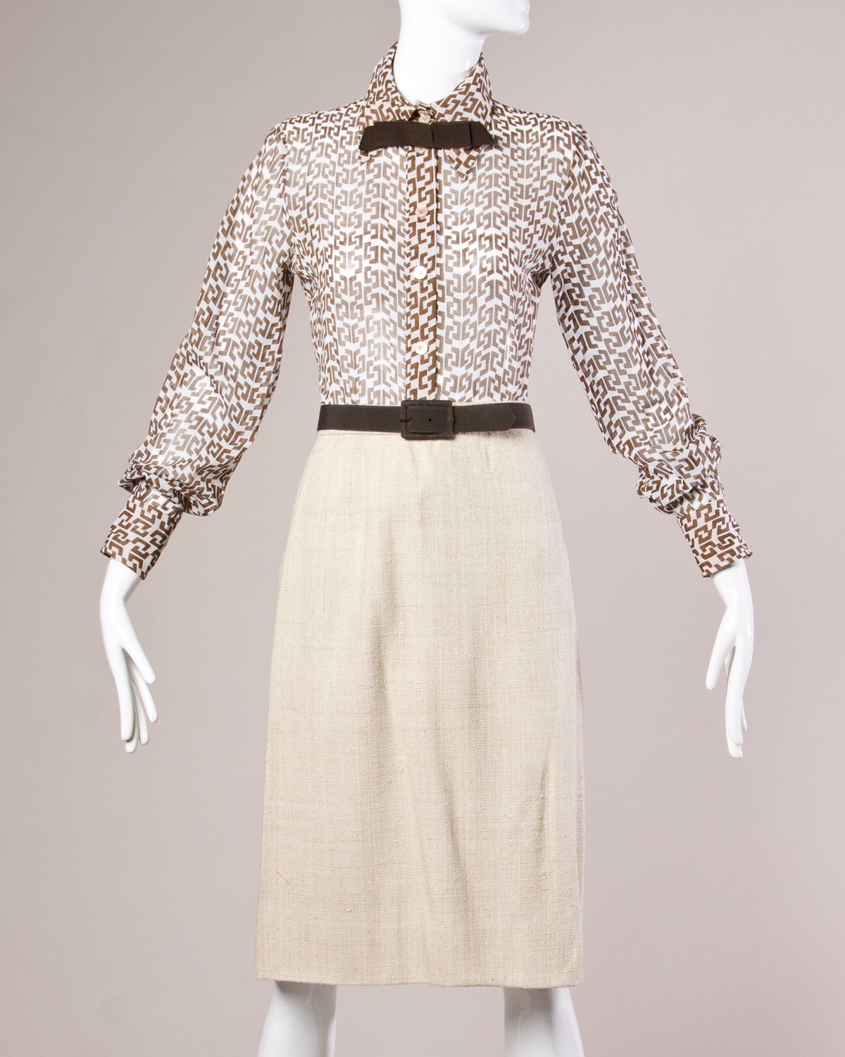 Reduced from $1,250. Unworn with the original price tags from Nan Duskin! Four-piece ensemble by Pauline Trigere includes a pencil skirt, jacket, blouse and belt. Wear together or separately.

Details:

Partially Lined
Matching Belt
Button