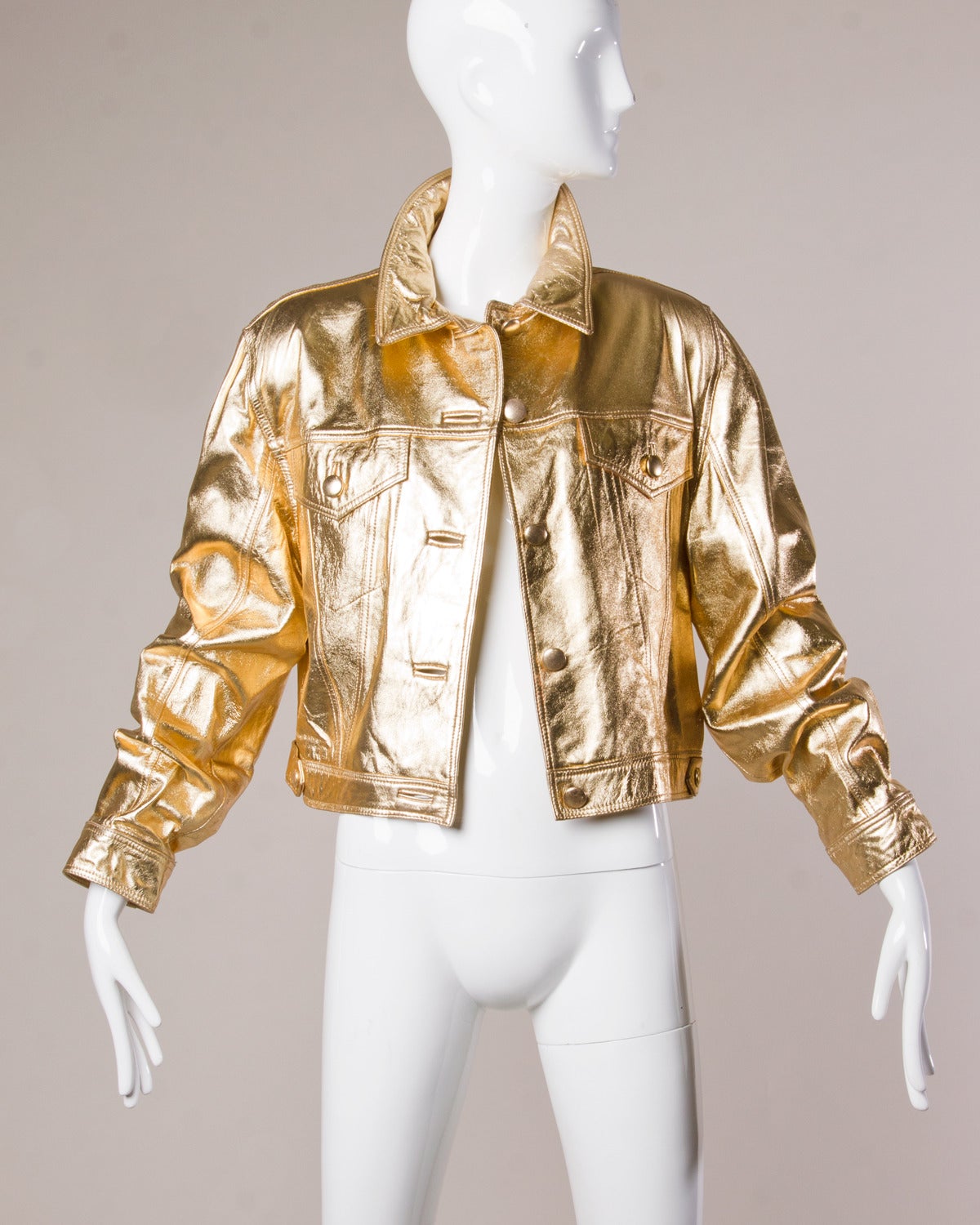 Incredible reflective metallic gold vintage leather jacket by Lillie Rubin. 

Details:

Fully Lined
Front Button Closure
Shoulder Pads Sewn into the Lining
Marked Size: Large
Estimated Size: Medium-Large
Label: Lillie