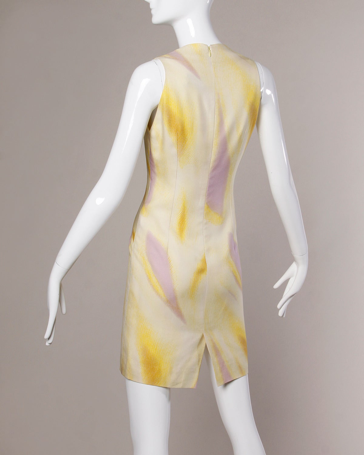 Vintage Gianni Versace Couture sheath dress in an abstract ombre pastel swirled silk. 

Details:

Unlined
Back Zip and Hook Closure
Marked Size: Not Marked
Estimated Size: S-M
Color: Yellow/ Cream/ Lavender
Fabric: Silk
Label: Gianni