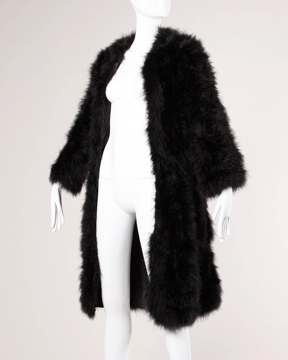 Details:

Fully Lined
Side Pockets
Front Hook Closure
Marked Size: M
Estimated Size: S-M
Color: Black
Fabric: Marabou Feathers/ Acetate Lining
Label: Not Marked

Measurements:

Bust: Up To 42