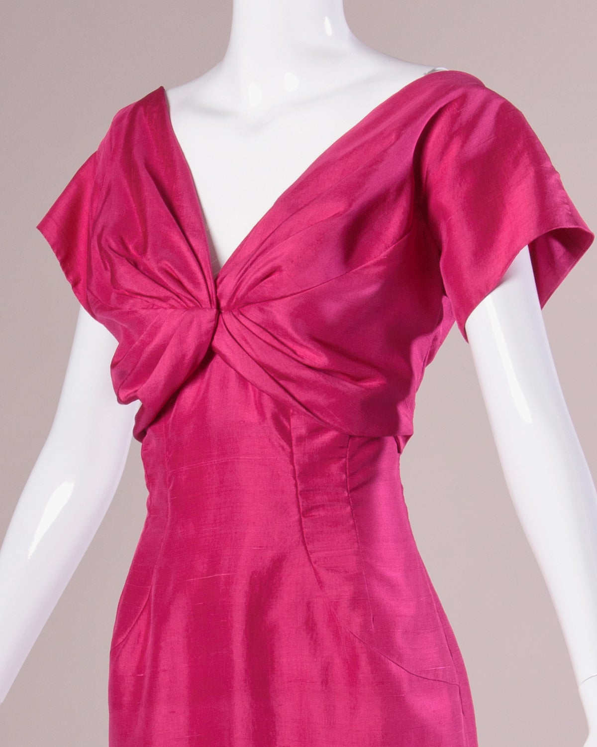 Bright fuchsia silk cocktail dress with short sleeves and gathered bust by Sydney North.

Details:

Fully Lined
Back Metal Zip and Hook Closure
Marked Size: Not Marked
Estimated Size: Medium
Color: Fuchsia
Fabric: Silk
Label: Sydney North/