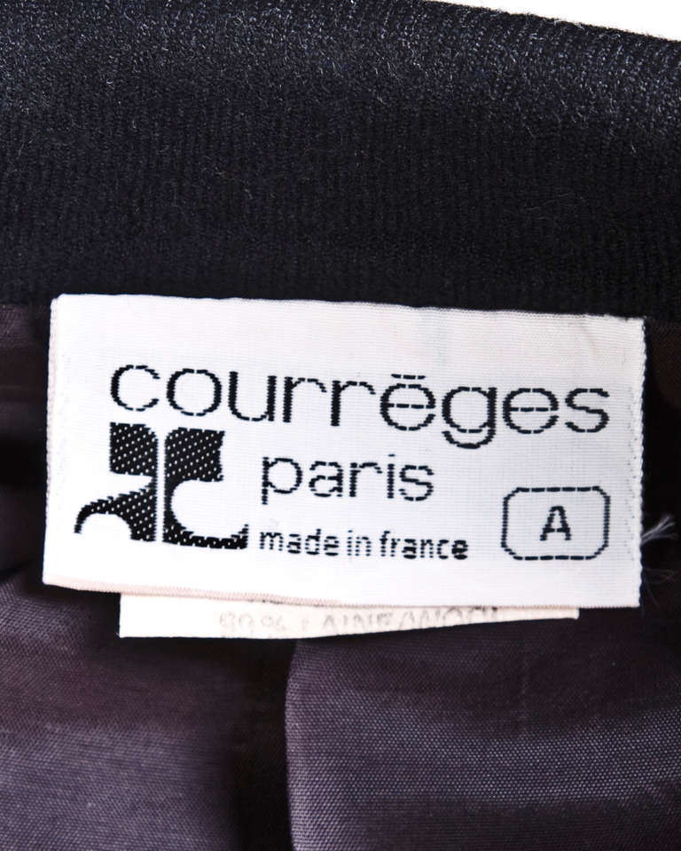 Perfectly tailored black wool jacket and skirt set by Courreges. The cut on both pieces is so unique and perfectly done! Gorgeous quality and condition. Both pieces work worn separately or together.

Details: 

Jacket: 
Fully lined
Front