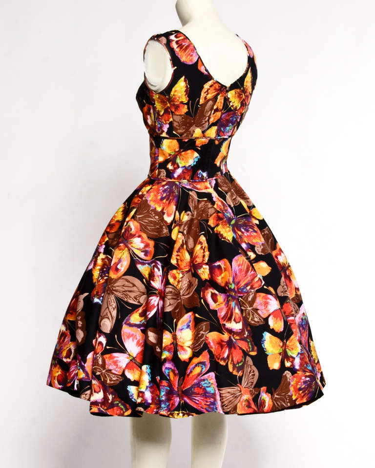 Completely amazing 1950's cotton dress with a vibrant rainbow butterfly print. Such a unique piece!

Details

    Partially lined
    Back metal zip and hook closure
    Side pockets
    Circa: 1950s
    Estimated Size: S-M
    Color: Black