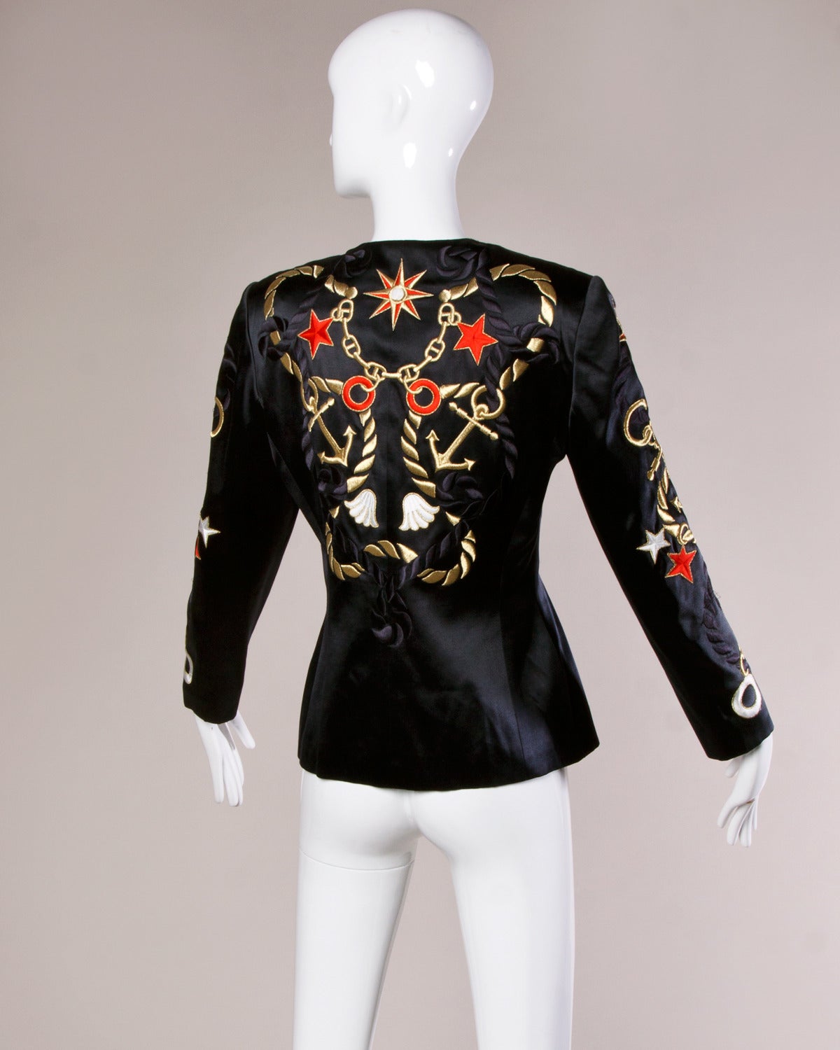 Vintage Escada blazer with Nautical-inspired novelty embroidery. 

Details:

Fully Lined
Structured Shoulder Pads Are Sewn Into Lining
Front Button Closure
Marked Size: 36
Color: Black Iridescent/ White Iridescent/ Red/ Gold