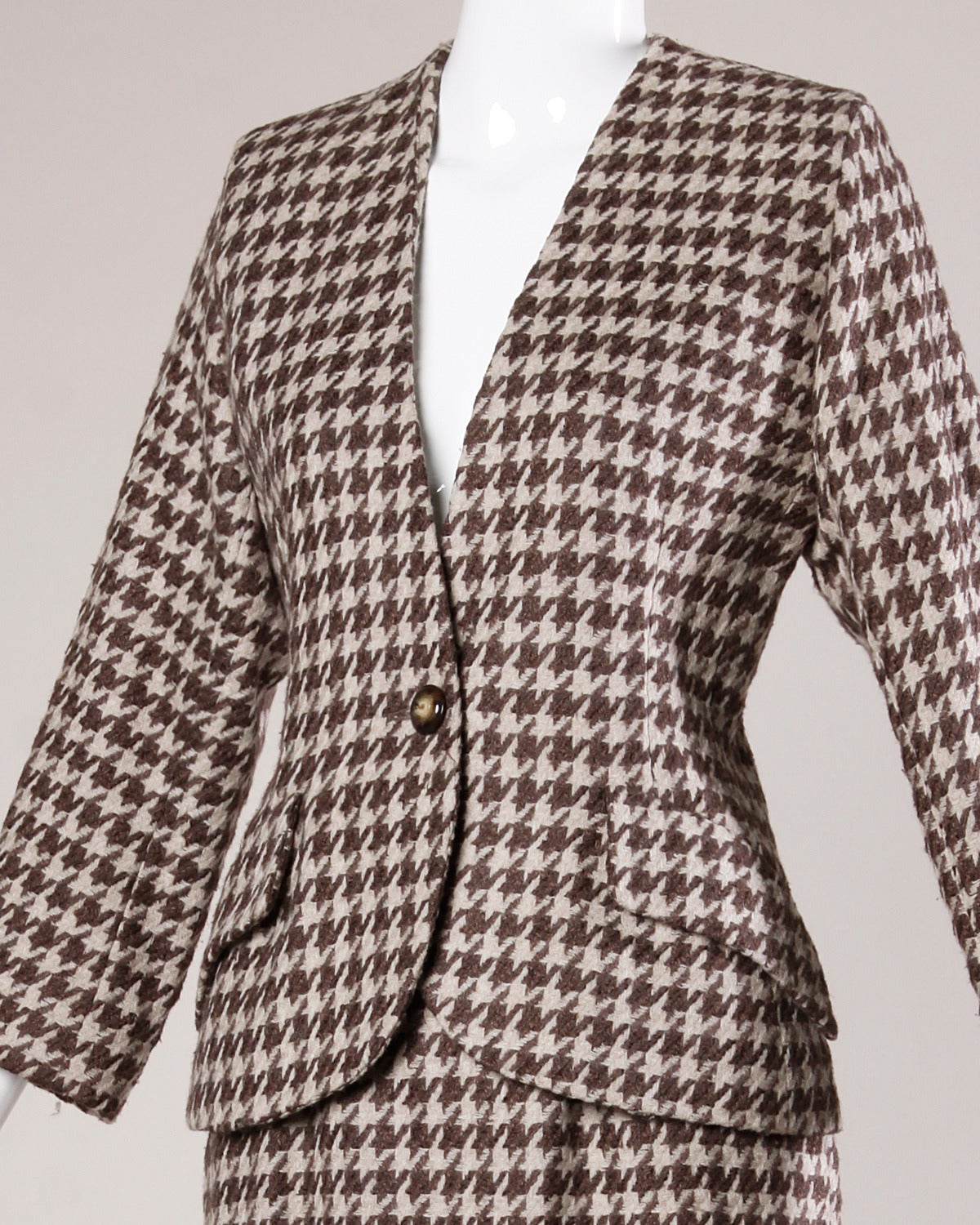 Brown and beige houndstooth skirt suit by Christian Dior. Wear together or separately!

Details:

Fully Lined
Front Pockets
Structured Shoulder Pads Are Sewn Into Lining
Front Button Closure On Jacket
Back Zip Button Closure On Skirt
Marked