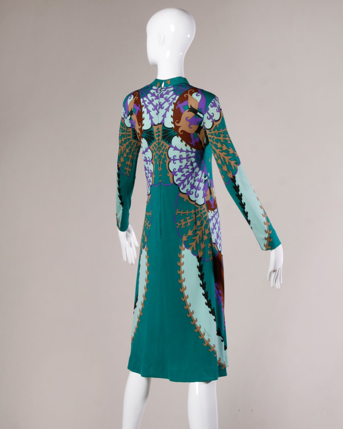 Gorgeous slinky Italian silk jersey dress by Domitilla for Holt Renfrew with a colorful mirror print. Domitilla signature in the print on the front of the dress. Gorgeous and coveted print and very rare designer.

Details:

Unlined
Back Zip and