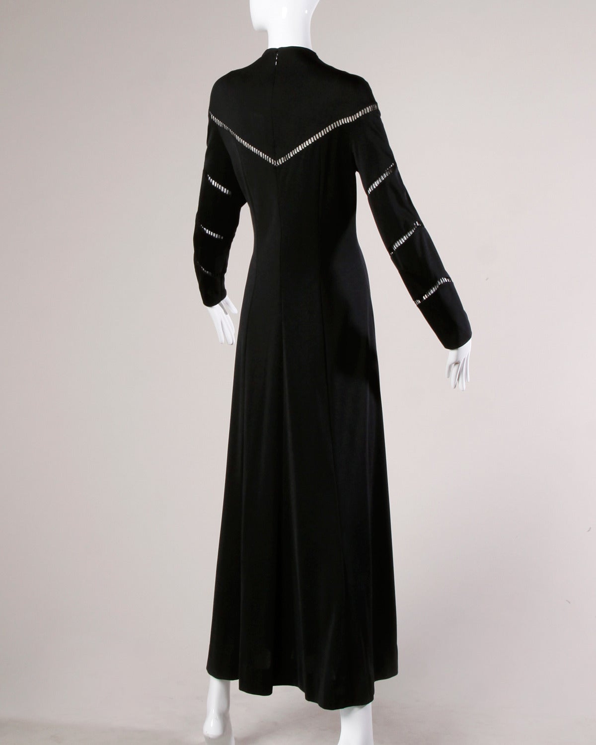 Vintage 1970s Mignon maxi dress in black jersey. Nude illusion cutout detail adds a twist to this classic dress.

Details:

Unlined
Back Zip and Hook Closure
Marked Size: Not Marked
Estimated Size: M-L
Color: Nude/ Black
Fabric: Jersey
