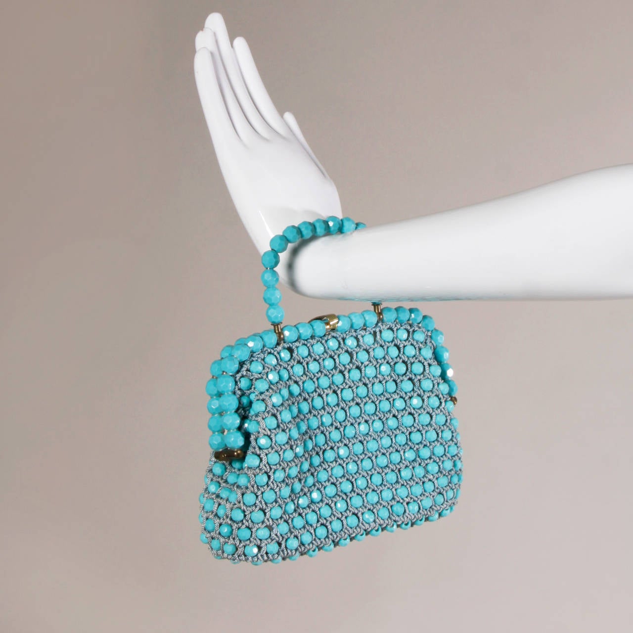 Wonderful robin's egg blue beaded cord bag by Harry Rosenfeld. Gorgeous construction and condition!

Details:

Fully Lined
Inside Pocket
Top Clasp Closure
Color: Robin's Egg Blue/ Gray Blue/ Gold
Material: Beads/ Rope/ Gold Plated