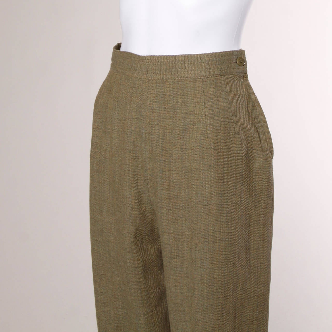 Chic high waisted wool trousers by Valentino in khaki.

Details:

Fully Lined
Side Zip and Button Closure
Marked Size: 8/40
Color: Green Khaki/ Light Mustard Yellow/ Multicolored
Fabric: Wool/ Nylon Lining
Label: Valentino Miss
